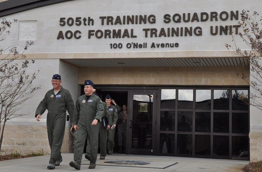 U.S. Air Warfare Center Commander Maj. Gen. Bill Hyatt, left front, and 505th Command and Control Wing Vice Commander Col. Mustafa Koprucu, right front, leave one of the wing's training facilities during a visit to Hurlburt Field, Fla., Dec. 16. General Hyatt and Command Chief CMSgt. Robert Sealey, both new to their positions, received immersion briefings and facility tours of the 505th CCW at Hurlburt Field and 53rd Wing at Eglin Air Force Base, Fla. The center oversees operations of both wings. (U.S. Air Force photo/Bill Dowell)