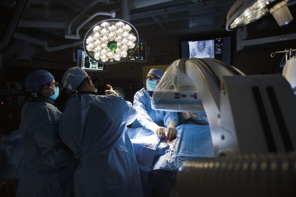 Vascular surgeons perform an abdominal aortic aneurysm repair procedure in the hybrid Cardiovascular Operating Room, located at the David Grant USAF Medical Center on Travis Air Force Base, Calif. U.S. Air Force photo/Tech. Sgt. Bennie J. Davis III)