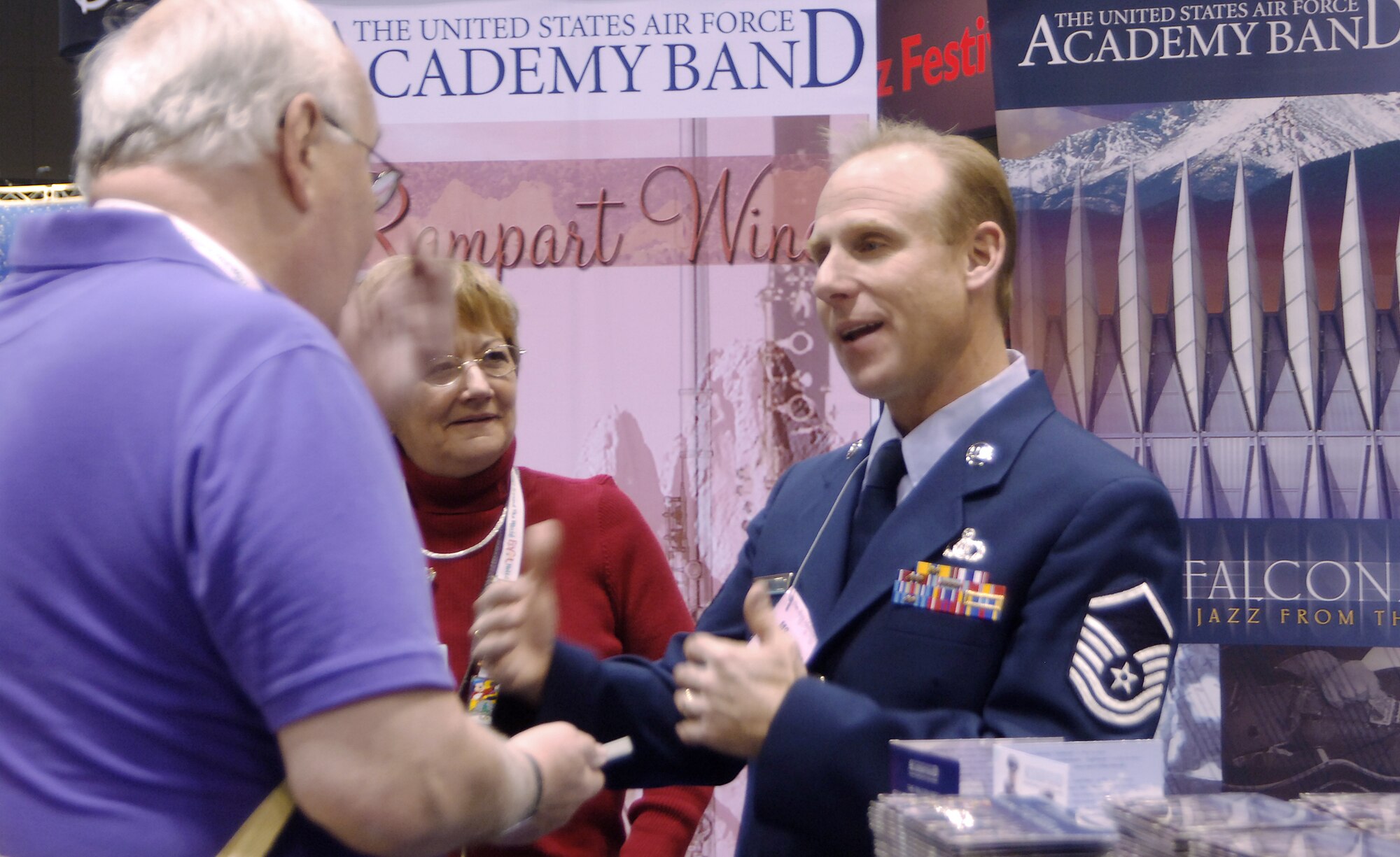 Master Sgt. Steve Przyzycki talks to Wayne Karge about the Academy Dec. 17, 2010, in Chicago during the Midwest Clinic International Band and Orchestra Conference. More than 16,000 people attended the event. Sergeant Przyzycki is a percussionist with the Air Force Academy band, and Mr. Karge is a band director in Palatine, Ill. (U.S. Air Force photo/2nd Lt. Meredith Kirchoff)