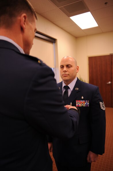 DYESS AIR FORCE BASE, Texas –Tech. Sgt. Michael Hamil, 7th Medical Operations Squadron, is awarded the Bronze Star Medal by Col. Jeffrey Thompson, 7th Medical Group commander, Dec. 17 during an award ceremony at the medical group here. Sergeant Hamil earned the award as a medical treatment NCO in charge while deployed in support of Operation Iraqi Freedom. The Bronze Star Medal is an individual military decoration awarded for bravery and acts of merit or meritorious service. (U.S Air Force photo/ Airman 1st Class Shannon Hall)   
