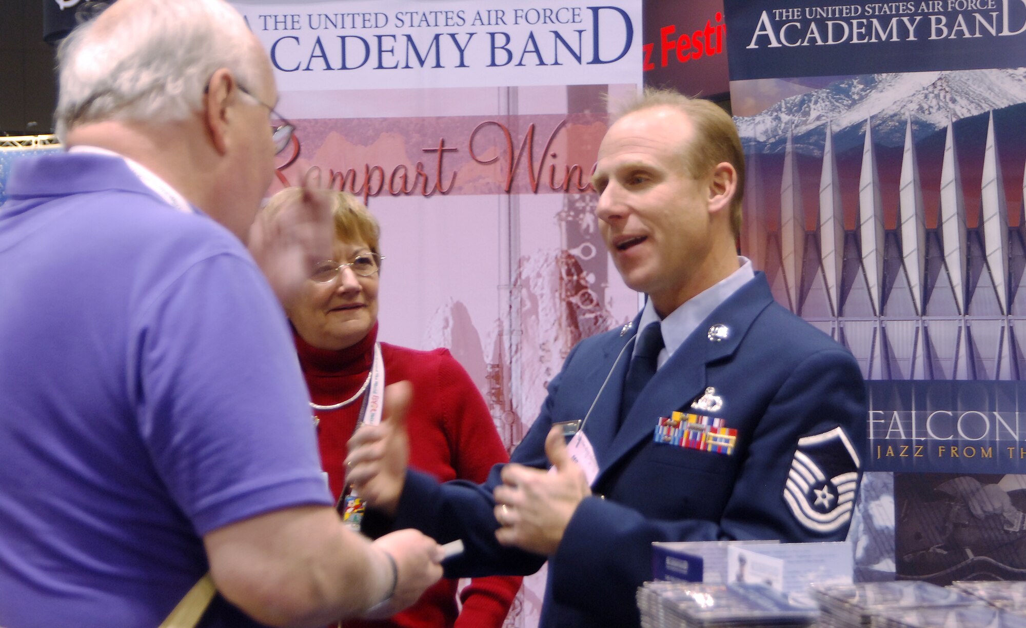 Master Sgt. Steve Przyzycki, a percussionist with the Air Force Academy Band, talks to Wayne Karge about the Academy during the Midwest Clinic International Band and Orchestra Conference in Chicago Dec. 17, 2010. More than 16,000 people attended the event. Mr. Karge is a band director in Palatine, Ill. (U.S. Air Force photo/2nd Lt. Meredith Kirchoff)