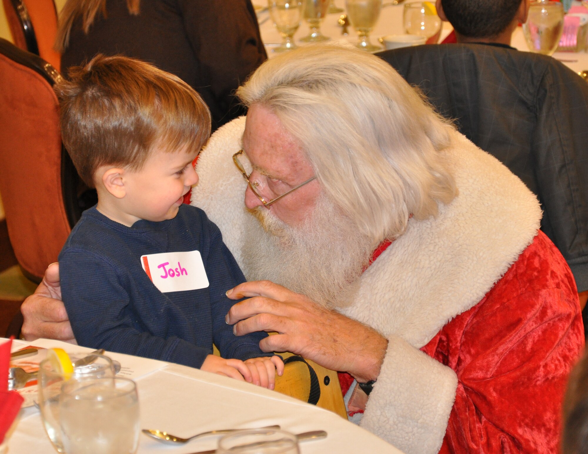Santa Claus visits with two-year-old Joshua, son of a deployed Airman, during the Hearts Apart annual holiday party Dec. 15 at the Soundside Club at Hurlburt Field, Fla. Throughout the year, the program sponsors a series of monthly gatherings for spouses and children of deployed members. (DoD photo by U.S. Airman 1st Class Joe McFadden / RELEASED) 