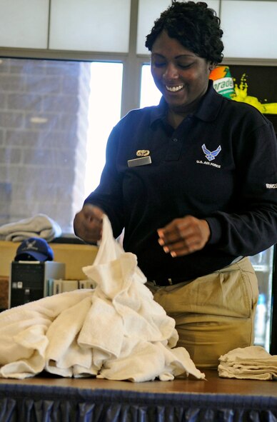 Senior Airman Tiffany Taylor, 2nd Force Support Squadron, folds clean towels at the fitness center on Barksdale Air Force Base, La., Dec. 21. Fitness center staff make sure the facility is clean, perform physical training tests for Barksdale Airmen and provide a great environment for Airmen to work out in. (U.S. Air Force photo/Staff Sgt. John Gordinier)
