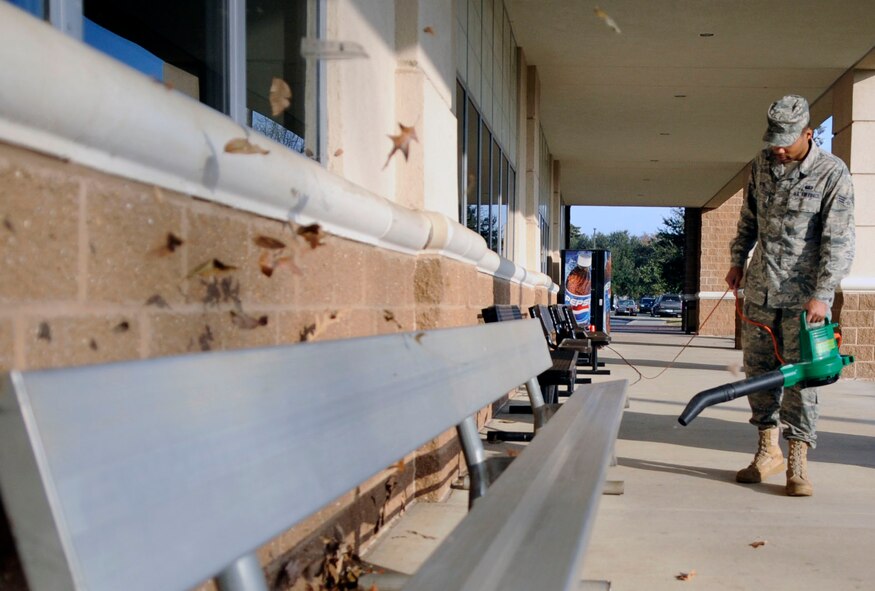 Senior Airman Michael Boyd, 2nd Force Support Squadron, cleans the outside area of the fitness center on Barksdale Air Force Base, La., Dec. 21. Fitness center staff make sure the facility is clean, perform physical training tests for Barksdale Airmen and provide a great environment for Airmen to work out in. (U.S. Air Force photo/Staff Sgt. John Gordinier)