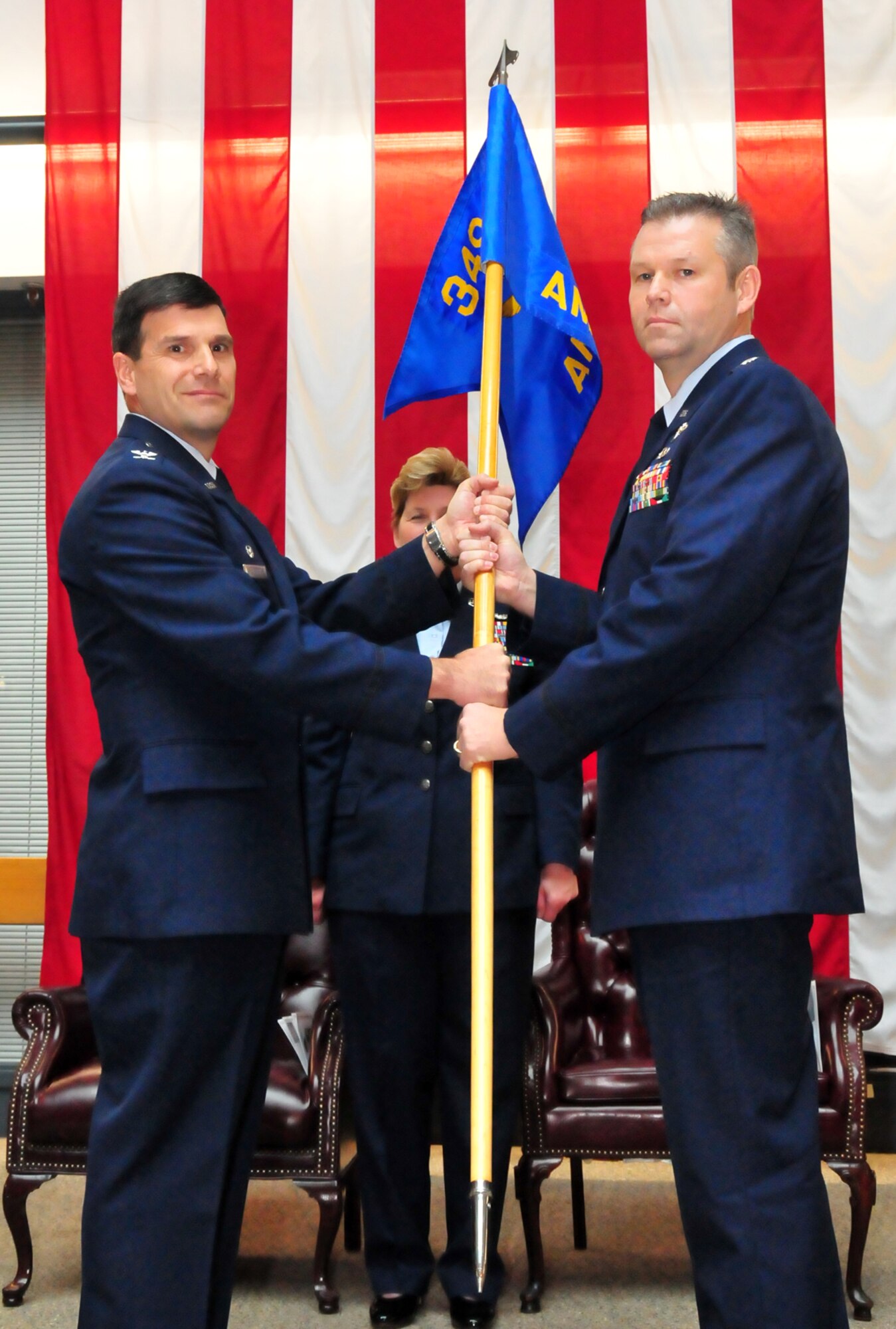 TRAVIS AIR FORCE BASE, Calif. -- The 349th Air Mobility Operations Squadron celebrated its change of command ceremony here recently. Col. Albert V. Lupenski, the 349th Operations Group commander, presents the unit’s guidon to the new commander of the 349th AMOS, Lt. Col. Patrick T. Williams. (U.S. Air Force photo/Master Sgt Robert Wade)