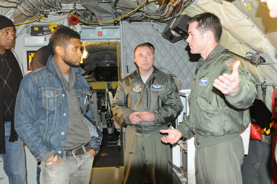 JOINT BASE ANDREWS, Md. -- R&B artist, Usher, visited the 459th Air Refueling Wing and was given a tour of a KC-135 Stratotanker along with other faciltiies here Dec. 17. During his visit, Usher also met with servicemembers and personally thanked them for defending the country. Later that evening he performed in a concert at the Verizon Center in Washington DC. (U.S. Air Force photo/Tech. Sgt. Steve Lewis)