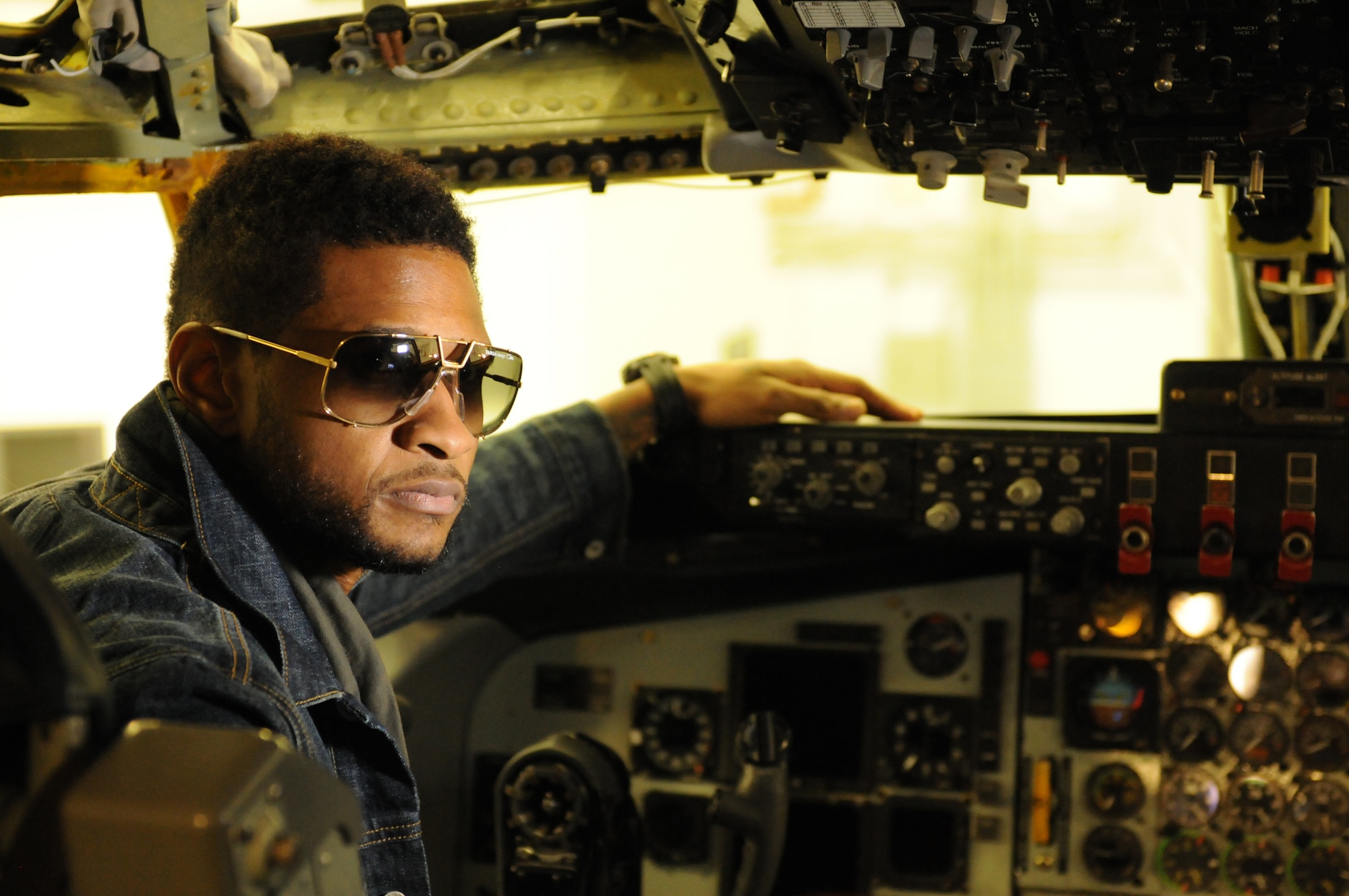 JOINT BASE ANDREWS, Md. -- R&B artist, Usher, visited the 459th Air Refueling Wing and was given a tour of a KC-135 Stratotanker along with other faciltiies here Dec. 17. During his visit, Usher also met with servicemembers and personally thanked them for defending the country. Later that evening he performed in a concert at the Verizon Center in Washington DC. (U.S. Air Force photo/Tech. Sgt. Steve Lewis)
