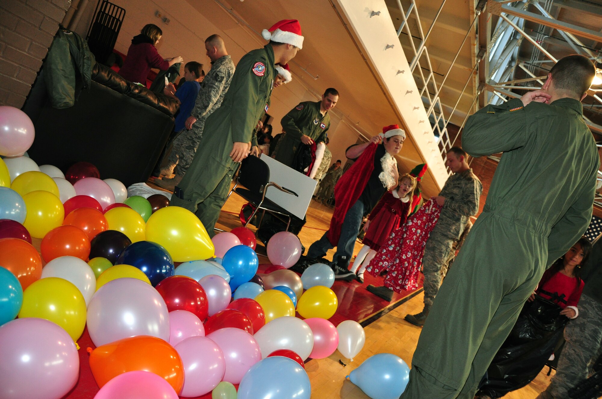 Warren members volunteer for Operation Provide Joy in the Fall Hall Community Center Dec. 11. Cheyenne youth enjoyed face painting, games, a magician performance and a visit from Santa Claus. (U.S. Air Force photo by Staff Sgt. Chad Thompson)