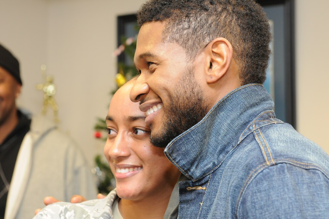 JOINT BASE ANDREWS, Md. -- R&B artist, Usher, visited the 459th Air Refueling Wing and was given a tour of a KC-135 Stratotanker along with other faciltiies here Dec. 17. During his visit, Usher also met with servicemembers and personally thanked them for defending the country. Later that evening he performed in a concert at the Verizon Center in Washington DC. (U.S. Air Force photo/Tech. Sgt. Steve Lewis)