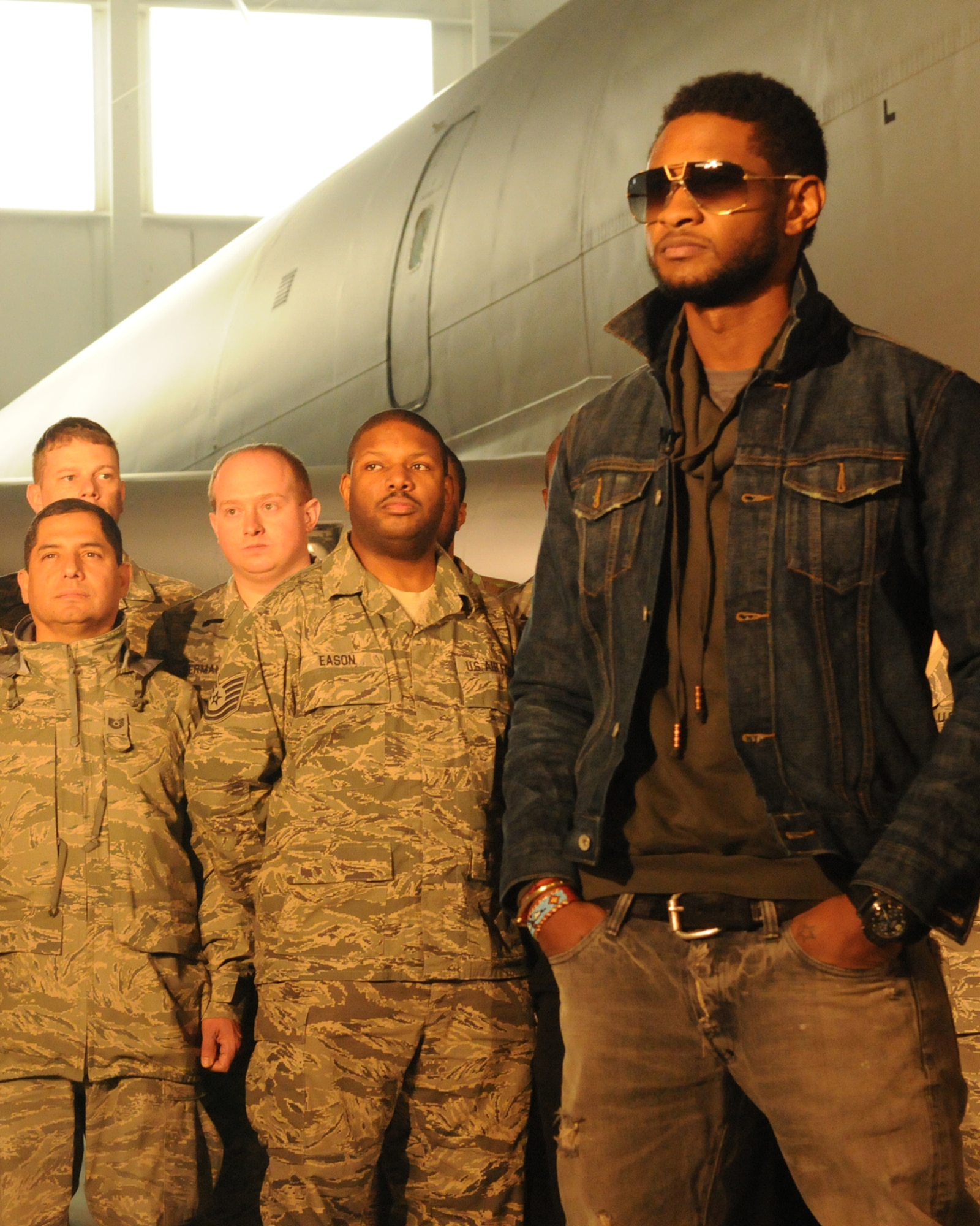 JOINT BASE ANDREWS, Md. -- R&B artist, Usher, records a Public Service Announcement with servcemembers stationed here Dec. 17. Along with recording the PSA, Usher also toured a KC-135 Stratotanker from the 459th Air Refueling Wing and other facilities on base. Later that evening he performed in a concert at the Verizon Center in Washington DC. (U.S. Air Force photo/Tech. Sgt. Steve Lewis)