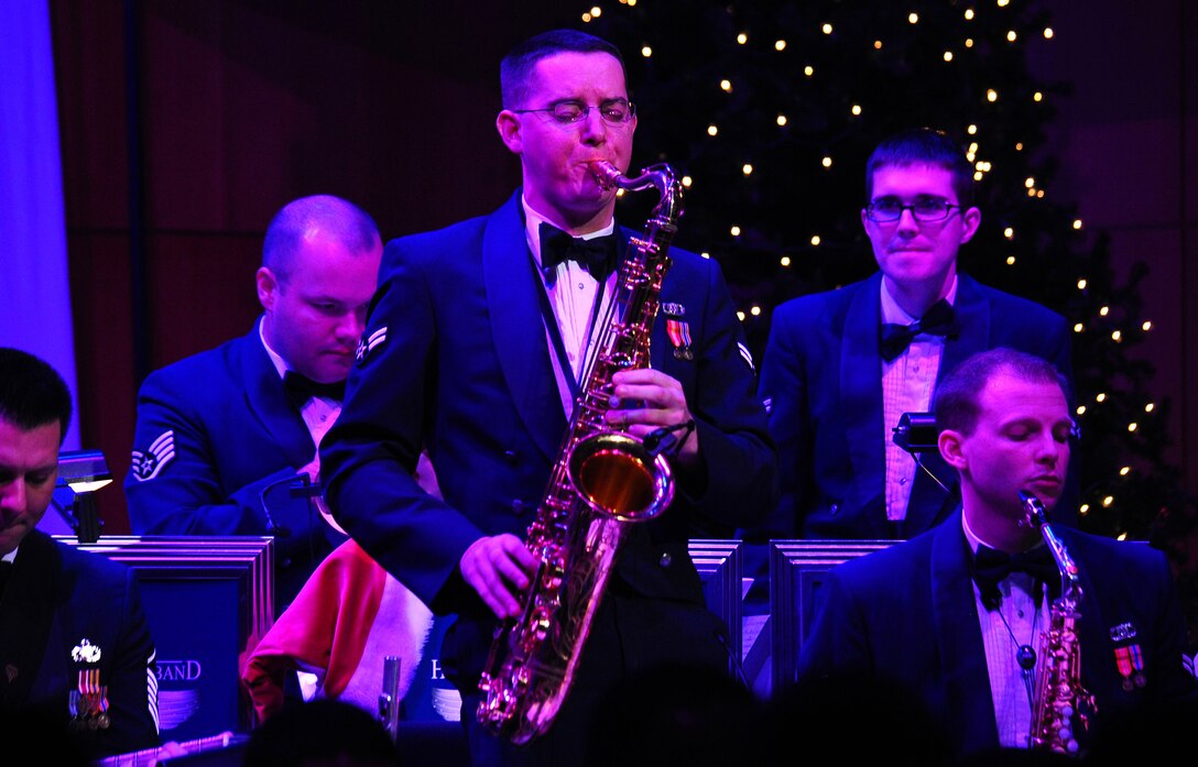 Airman First Class Greg Pflugh takes a solo on The Noteables' take of the holiday standard 'Have Yourself A Merry Little Christmas.'  The performance was part of the USAF Heartland of America Band's annual holiday concert series which took place at the Holland Performing Arts Center in downtown Omaha, Neb.