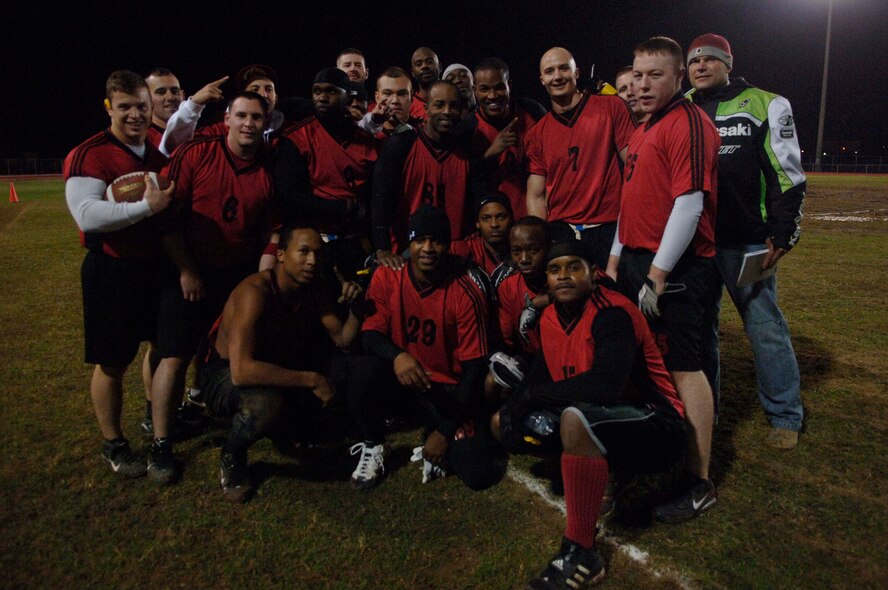 The 39th Security Forces Squadron poses after beating the 39th Maintenance Squadron 34-6 in the 2010 Flag Football Championship game Dec. 13, at Incirlik Air Base, Turkey. SFS finished the season undefeated with 12 wins and zero losses.  (U.S. Air Force photo by Ashley Wood/Released)