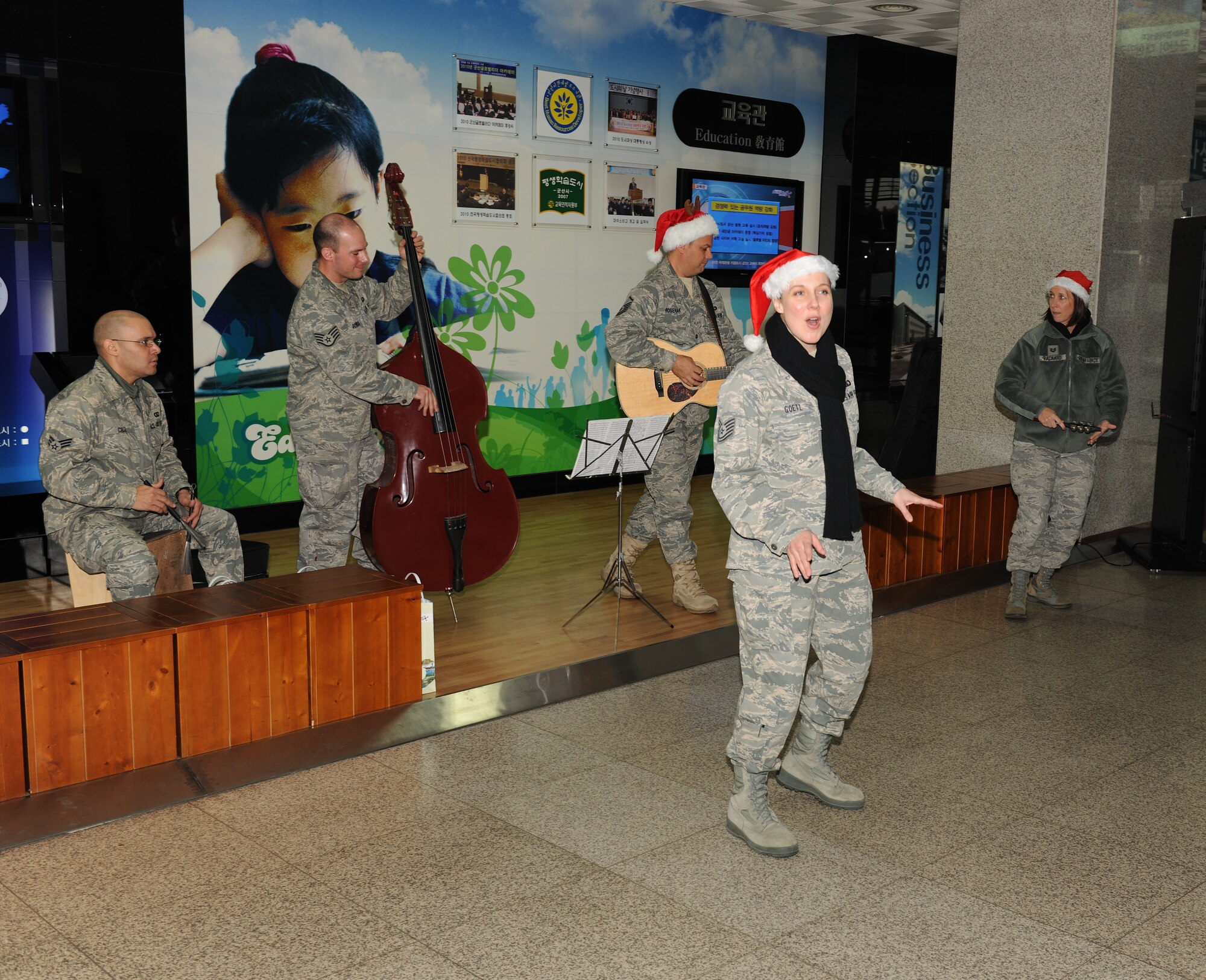 KUNSAN AIR BASE, Republic of Korea -- Airmen from the U.S. Air Force Band of the Pacific-Asia's Pacific Trends ensemble sing to citizens at Gunsan City Hall Dec. 17. The group performed for the Wolf Pack and citizens at the Gunsan City Hall to lift holiday spirits and promote friendship between the countries. (U.S. Air Force photo/Master Sgt. Jason Wilkerson)