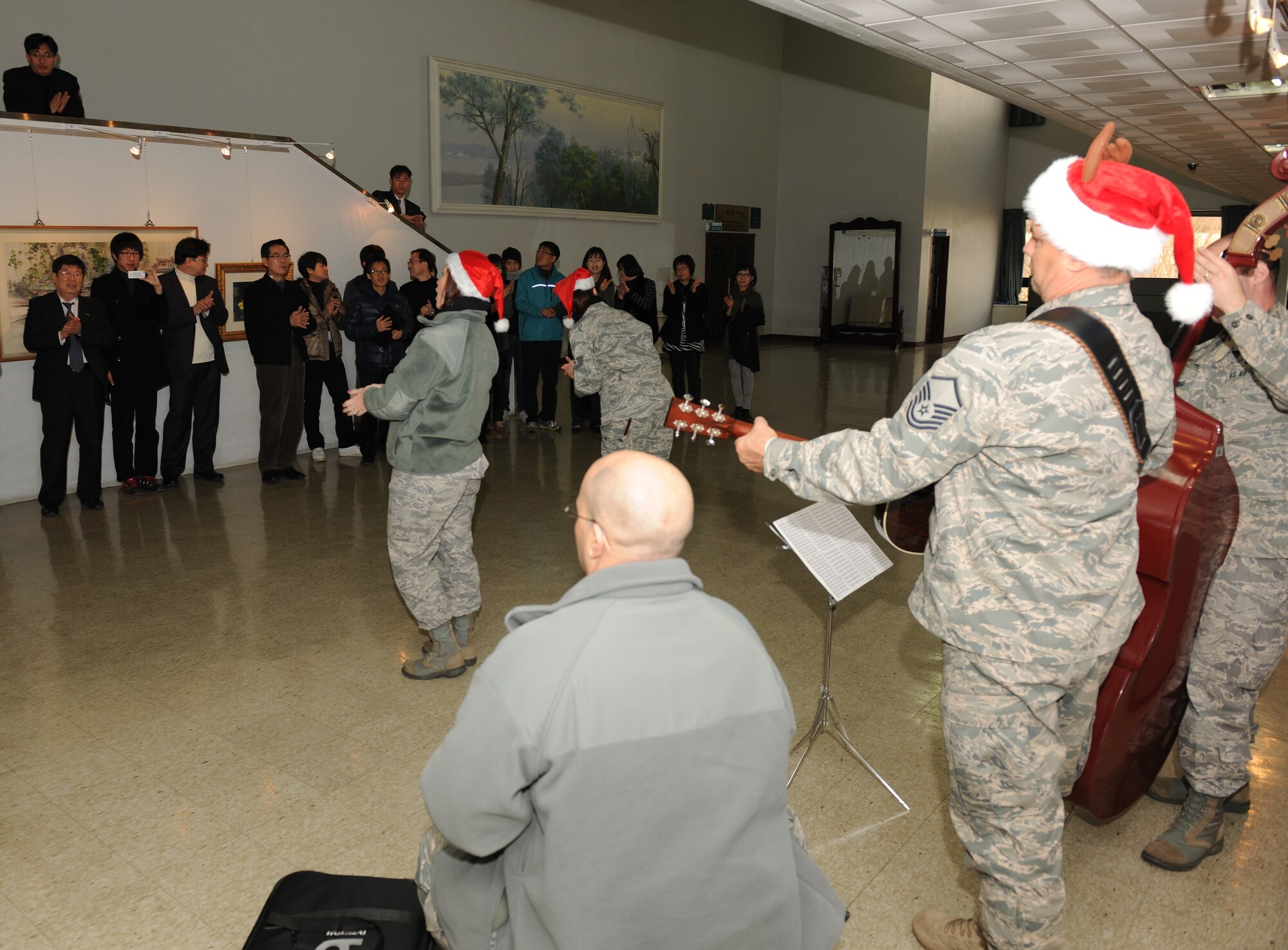 KUNSAN AIR BASE, Republic of Korea -- Airmen from the U.S. Air Force Band of the Pacific-Asia's Pacific Trends ensemble sing to citizens at Gunsan City Hall Dec. 17. The group performed for the Wolf Pack and citizens at the Gunsan City Hall to lift holiday spirits and promote friendship between the countries. (U.S. Air Force photo/Master Sgt. Jason Wilkerson)