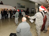 KUNSAN AIR BASE, Republic of Korea -- Airmen from the U.S. Air Force Band of the Pacific-Asia's Pacific Trends ensemble sing to citizens at Gunsan City Hall Dec. 17. The group performed for the Wolf Pack and citizens at the Gunsan City Hall to lift holiday spirits and promote friendship between the countries. (U.S. Air Force photo/Master Sgt. Jason Wilkerson)