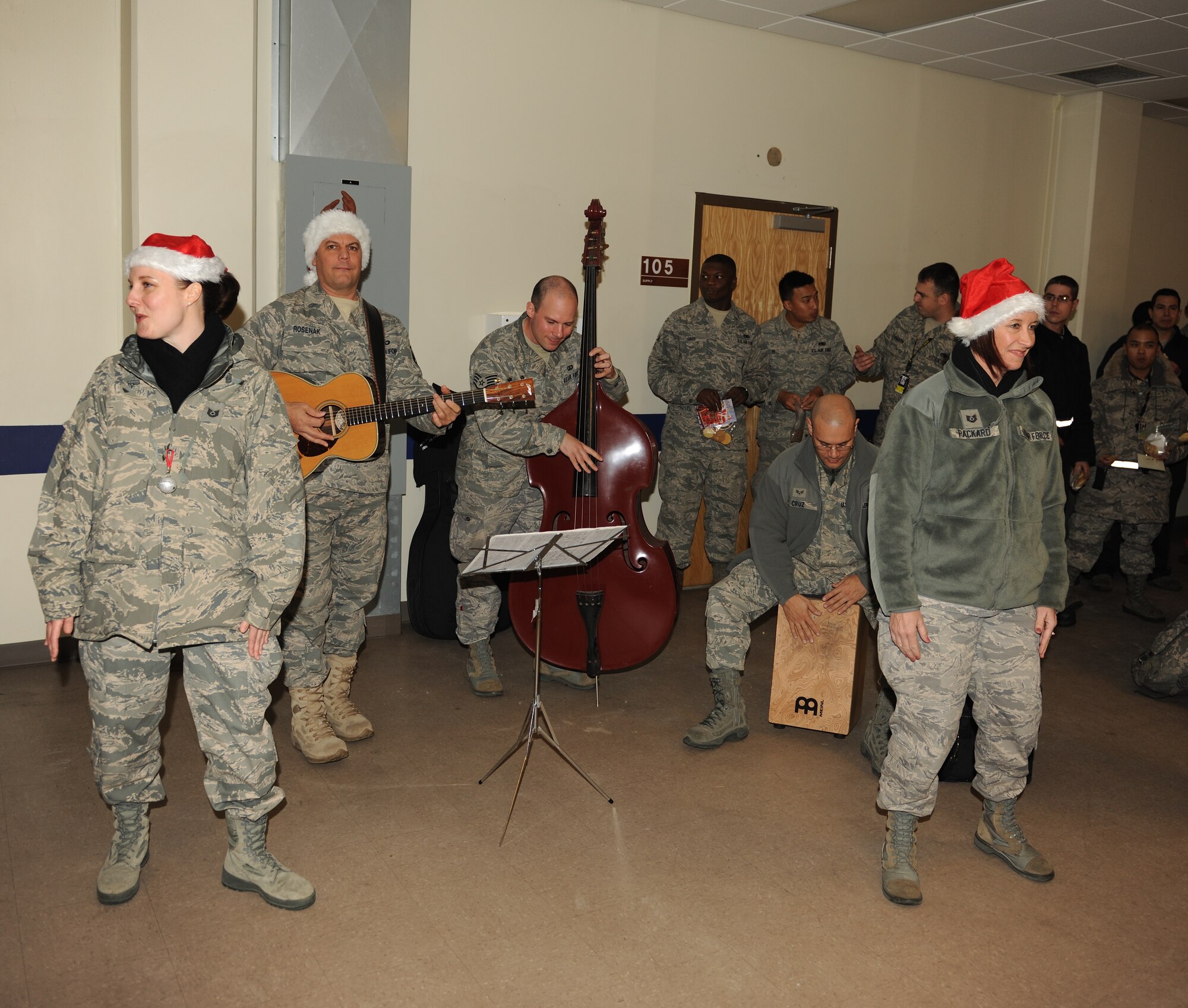 KUNSAN AIR BASE, Republic of Korea -- Members of the U.S. Air Force Band of the Pacific-Asia's Pacific Trends ensemble perform for 8th Aircraft Maintenance Squadron Airmen Dec. 17. The group performed for the Wolf Pack and citizens at the Gunsan City Hall to lift holiday spirits and promote friendship between the countries. (U.S. Air Force photo/Senior Airman Ciara Wymbs)