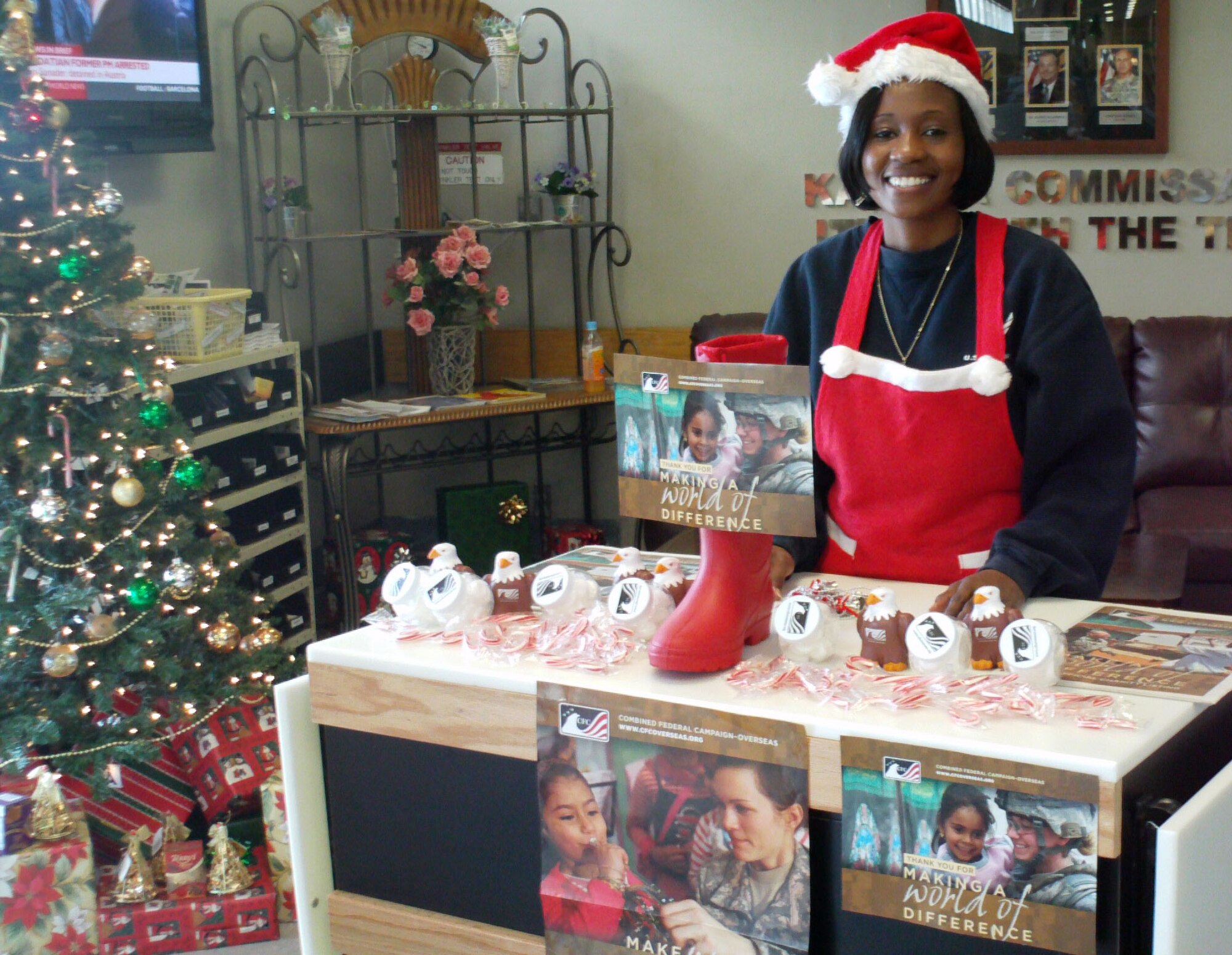 Senior Master Sgt. Stephanie Baker, Kadena CFC community project officer, volunteers to collect donations at the CFC Fill Santa’s Boot fundraiser at Kadena’s commissary, Dec. 11. Fill Santa’s Boot was the last fundraiser for this year’s CFC and raised $520. (Courtesy photo)