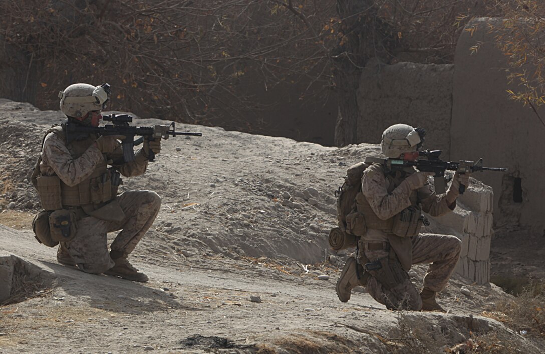 While in Sangin’s southern area of operations, Marines scan the area before moving to an objective point, Dec. 23, 2010. The Marines of 2nd Platoon, India Company, 3rd Battalion, 5th Marine Regiment departed Forward Operating Base Jackson on an operation to secure a new patrol base in the area. Although the Marines were met with enemy fire, they quickly maneuvered, killed the enemy and seized their objective area.