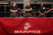 Pfc. Brittany Dexter, 19, from Blaine, Minn., Sgt. Dae Kim, 25, from Stockton, Calif., and Pvt. Nicholas Thomas, 20, from White Bear Lake, Minn., scan for individuals to take the pull-up or flexed-arm hang challenge at the Target Center Dec. 22 where the Minnesota Timberwolves took on the Utah Jazz. Dexter and Thomas recently completed Marine Corps boot camp and are currently serving at the Coon Rapids and Woodbury recruiting substations.