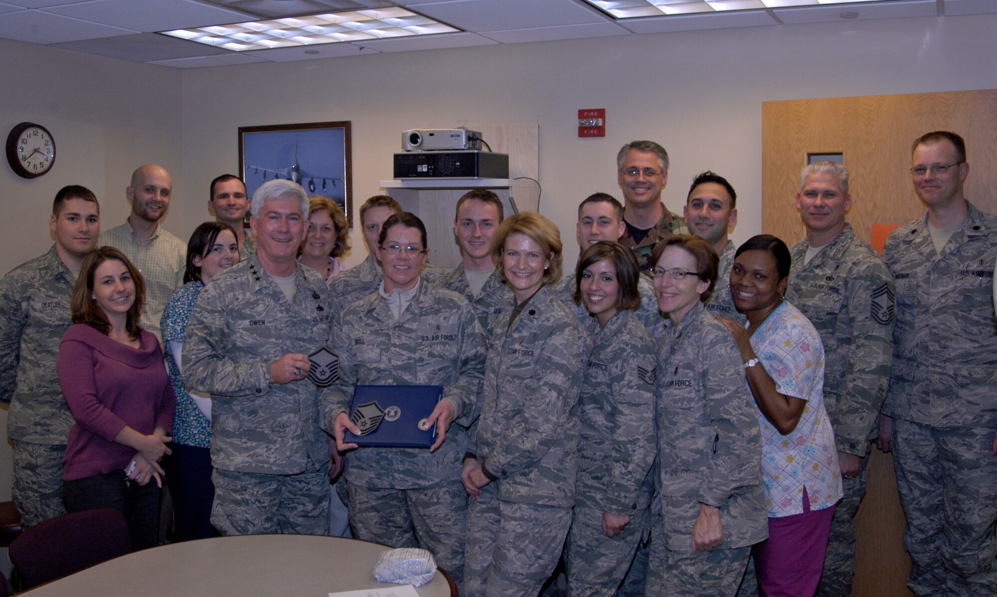Tech. Sgt. Beverly Bull is congratulated by Lt. Gen. Thomas Owen and coworkers at Wright-Patterson Medical Center following her surprise promotion to Master Sergeant Dec. 21, 2010 at Wright-Patterson Air Force Base, Ohio.  General Owen promoted Sergeant Bull via the Stripes for Exceptional Performers program. Sergeant Bull is Pediatric Flight chief with the 88th Medical Operations Squadron and General Owen is commander of Aeronautical Systems Center. (U.S. Air Force photo/Derek Kaufman)