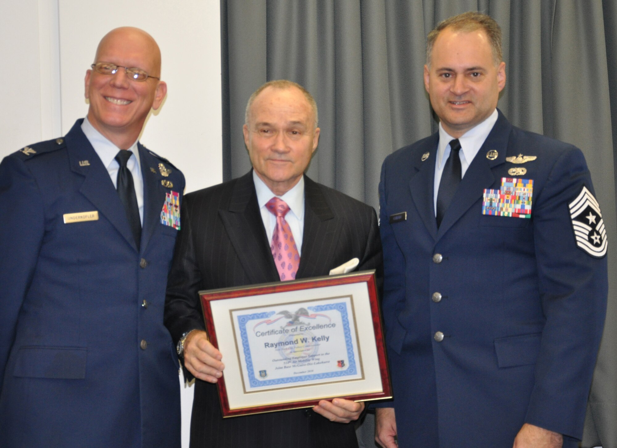 JOINT BASE MCGUIRE-DIX-LAKEHURST, N.J. -- Col. Michael Underkofler, (left) vice wing commander and Command Chief Master Sergeant, Michael Ferraro, both of the 514th Air Mobility Wing, here, recognize New York Police Commissioner Raymond W. Kelly for his support of the Air Force Reserve Dec. 13 during a Reserve employer outreach trip to the New York City Police Department Headquarters, New York, NY. (U.S. Air Force photo/Master Sgt. Donna T. Jeffries)