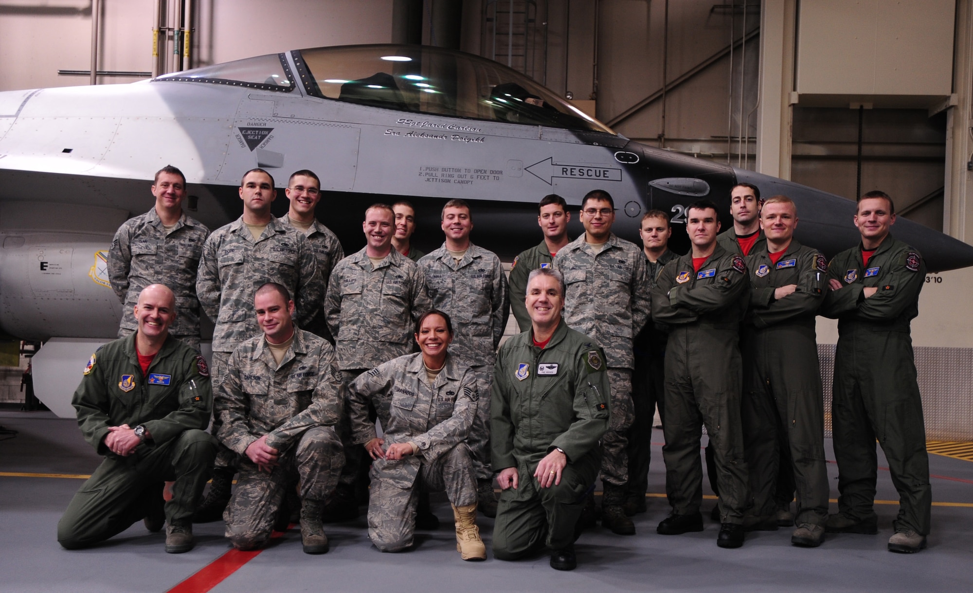 Pilots and crew chiefs gather for a group photo after a Dedicated Crew Chief induction Dec. 17, 2010 Eielson Air Force Base, Alaska.  The crew chiefs were recognized for exceptional service and dedication to the mission, knowledge level and leadership skills which are crucial to the success of the F-16 mission here. The Airmen are assigned to the 354th Aircraft Maintenance Squadron and 18th Aggressor Squadron. (U.S. Air Force photo/Airman 1st Class Laura Goodgame)
