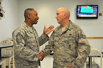 Chief Master Sgt. Alvin Blake (left), 802nd Security Forces Squadron, wishes Staff Sgt. Alan Dupuis well before his deployment Dec. 22. Sergeant Dupuis, 802nd SFS, is among more than 45 Airmen from Lackland, Goodfellow, Dyess and Randolph Air Force Bases deploying to Iraq in support of Operation New Dawn. (U.S. Air Force photo/Alan Boedeker)