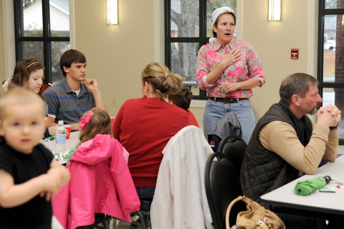 Col. Martha Meeker gives opening remarks at the beginning of the children of deployed members holiday party held at the chapel annex Dec. 18, 2010, on Joint Base Charleston, S.C. The holiday party was held by the Honorary Commanders Advisory Council with gifts and food supplied by local businesses. Colonel Meeker is the JB CHS commander.(U.S. Air Force photo/Staff Sgt. Marie Brown)