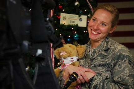 Senior Airman Jessica Seibert, 59th Surgical Inpatient Squadron, holds her stuffed animal while being interviewed Dec. 22 at the Lackland Air Force Base passenger terminal. Airman Seibert brought a stuffed animal on her deployment as a reminder of the golden retriever she left at home. She was one of more than 45 Airmen, the majority from the 59th Medical Wing, who deployed for approximately six months in support of Operation New Dawn.  (U.S. Air Force photo/Senior Airman Corey Hook)

