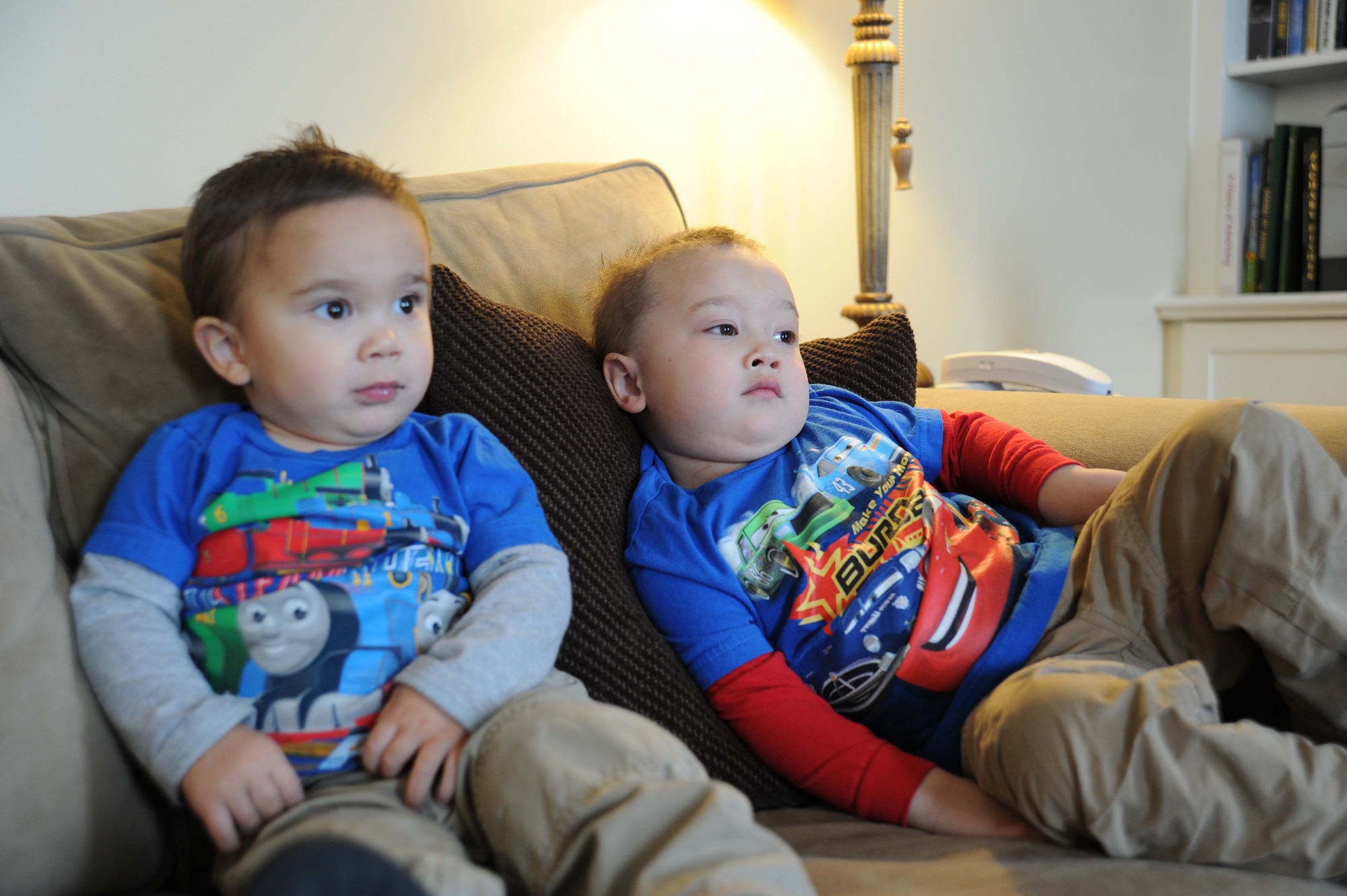 Emeric and Zavian Arndt relax on the living room couch while watching cartoons at the Andrews Air Force Base, Md. Fisher House. Zavian is a 3 year-old leukemia patient receiving treatment at Walter Reed Army Medical Center. He and his family are guests at the Fisher House while he undergoes specialized medical care. (U.S. Air Force Photo by Tech. Sgt. Chyenne A. Adams)