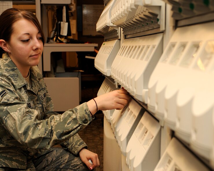 Airman 1st Class Ashley Parker, 2nd Medical Group pharmacy technician, fills prescriptions and verifies pill counts for Barksdale patients Dec. 22 at the Barksdale pharmacy. The Barksdale pharmacy provides medication for military members, retirees and dependents.  (U.S. Air Force photo/Senior Airman Allison M. Boehm)(RELEASED)