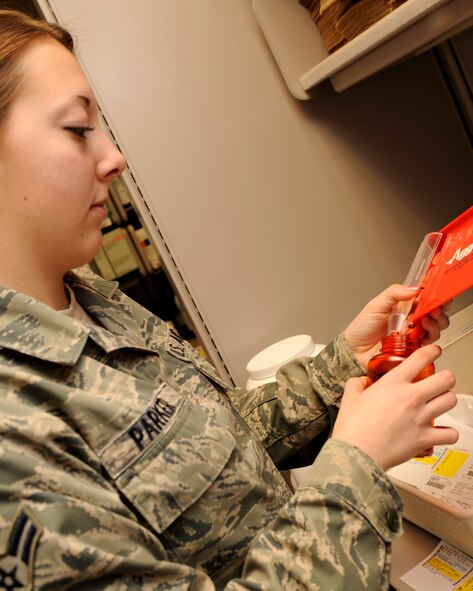 Airman 1st Class Ashley Parker, 2nd Medical Group pharmacy technician, fills prescriptions and verifies pill counts for Barksdale patients Dec. 22 at the Barksdale pharmacy. The Barksdale pharmacy provides medication for military members, retirees and dependents.  (U.S. Air Force photo/Senior Airman Allison M. Boehm)(RELEASED)