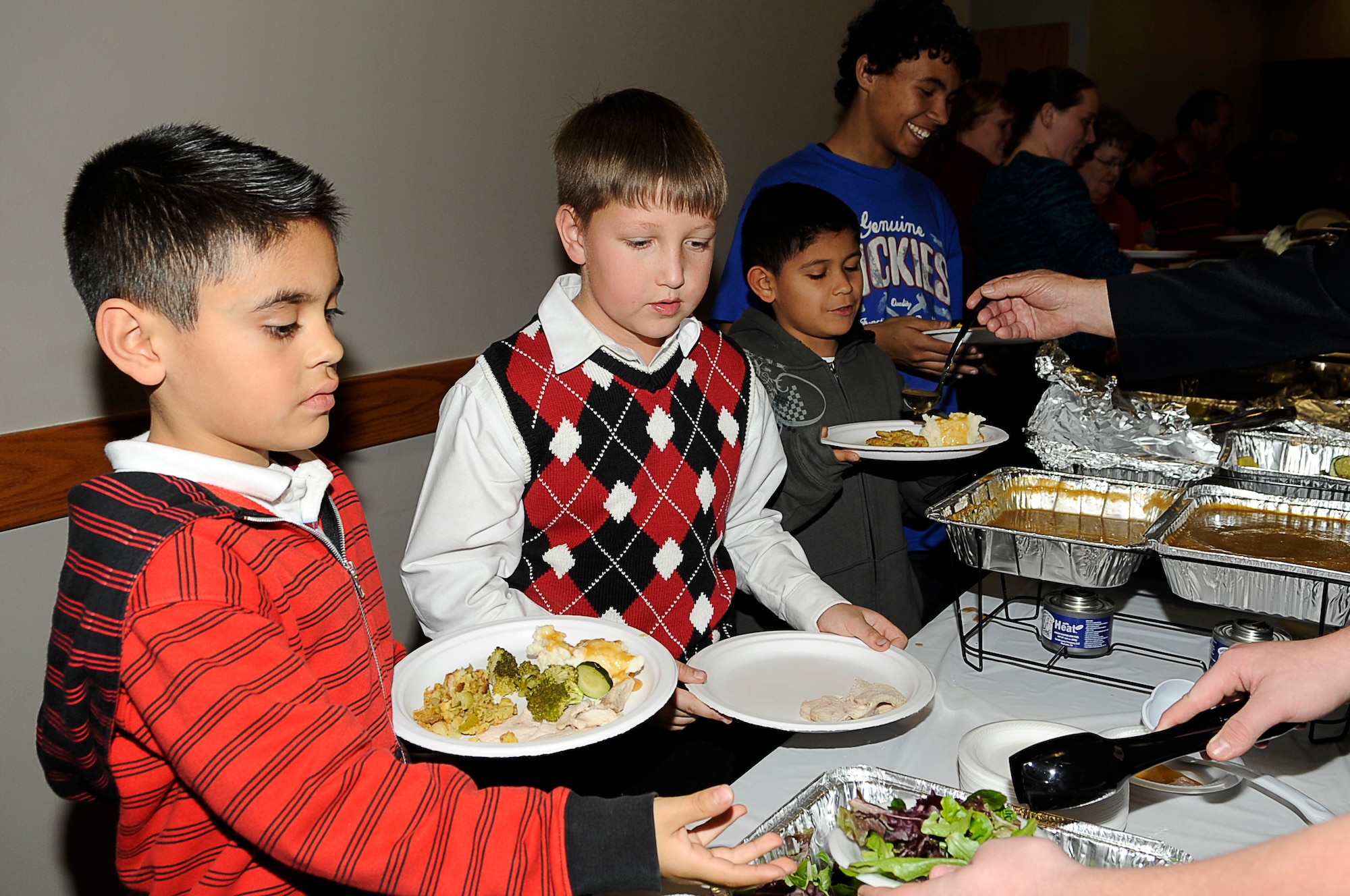 Families enjoy the festivities at the Deployed Spouses Holiday Party Dec. 17, 2010. (U.S. Air Force photo by/ Master Sgt. Jeromy K. Cross/released)
