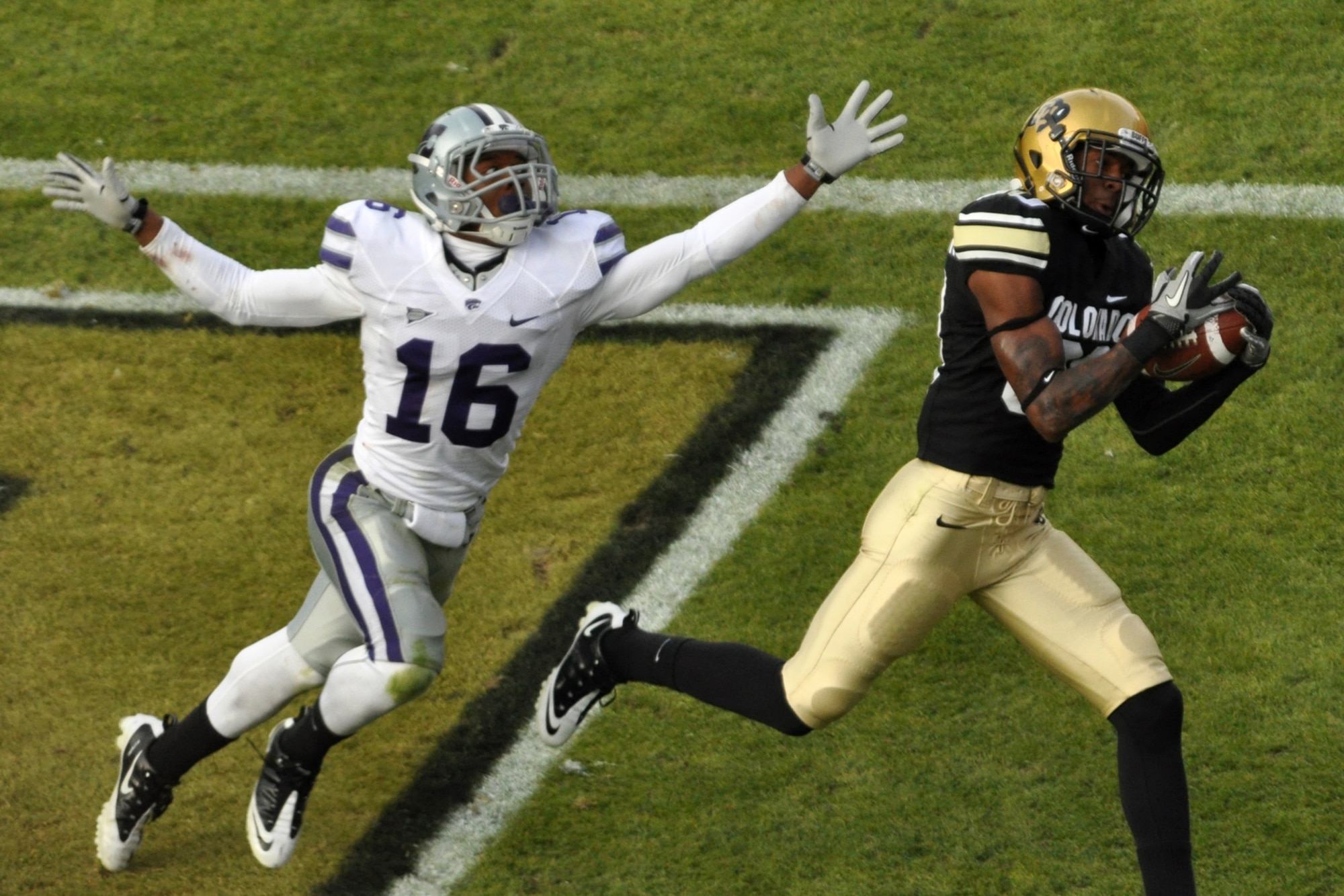 Terrance Sweeney (16), a defensive back for Kansas State University doesn’t have the reach to block a touchdown catch made by University of Colorado wide receiver Paul Richardson (80) during a contest between the two college football teams at Folsom Field in Boulder, Colo., Nov. 20, 2010. CU went on to win the game with K-State 44-36. (Courtesy photo/Jeff Walston)  