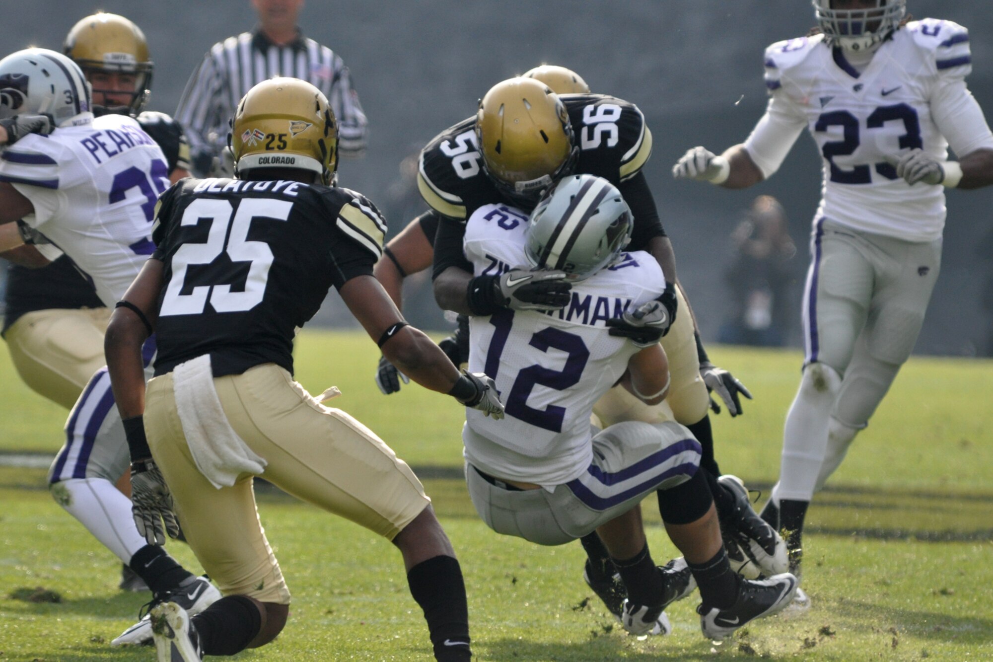 Kansas State defensive back Ty Zimmerman (12) comes to an abrupt stop at the hands of Derrick Webb (56), an inside linebacker for the University of Colorado, during the football game between the two university teams at Folsom Field in Boulder, Colo., Nov. 20, 2010. CU went on to win the game with K-State 44-36. (Courtesy photo/Jeff Walston)  