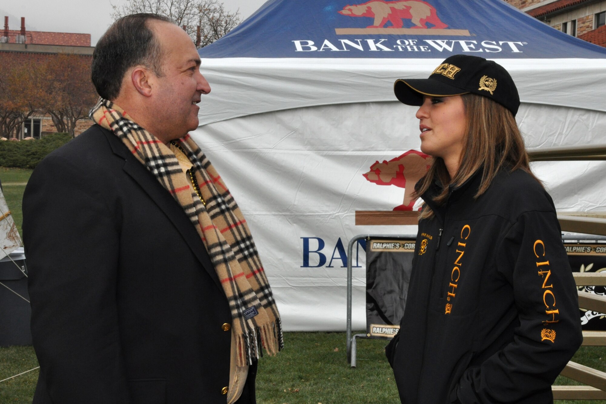 Lt. Col. (Ret) Charlie Morgan, a former process manager for the 917th Wing at Barksdale Air Force Base, La., speaks with his daughter Danielle Morgan before the game between the University of Colorado and Kansas State University at Folsom Field in Boulder, Colo., Nov. 20, 2010. Danielle, who attended Louisiana State University-Eunice in Bossier City, La., her freshman and sophomore years of college, is now a senior at CU and a Ralphie Handler. Ralphie, a live buffalo, is one of the more unique mascots in all of intercollegiate athletics. She leads the football team out on the field both at the start of the game and second half. It was in the final game of the 1934 season, when a live buffalo made its first appearance when a group of students paid $25 to rent a buffalo calf along with a real cowboy as his keeper. It took the cowboy and four students to keep the calf under control on the sidelines during the 7-0 win at the University of Denver on Thanksgiving Day. (Courtesy photo/Jeff Walston)