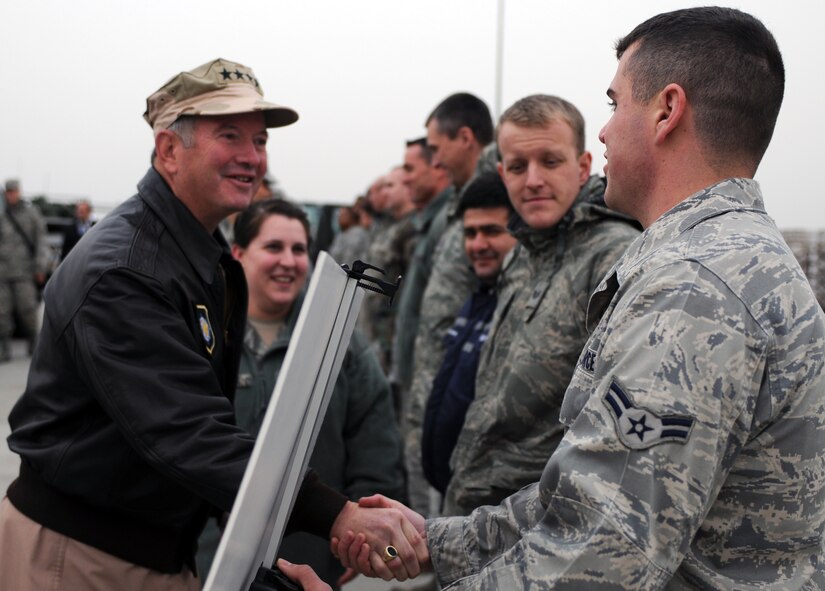Airman 1st Class Justin Hunt, with the 728th Air Mobility Squadron, greets Gen. Duncan J. McNabb, the commander of the U.S. Transportation Command, during his visit Dec. 17, 2010 to Incirlik Air Base, Turkey. During General McNabb’s visit to the 39th Air Base Wing he spoke to Airmen at a commander’s call and visited with members of the 39th Maintenance Squadron, 728th AMS, 39th Security Forces Squadron and the 90th Expeditionary Air Refueling Squadron. (U.S. Air Force photo by Senior Airman Sara Csurilla/Released)