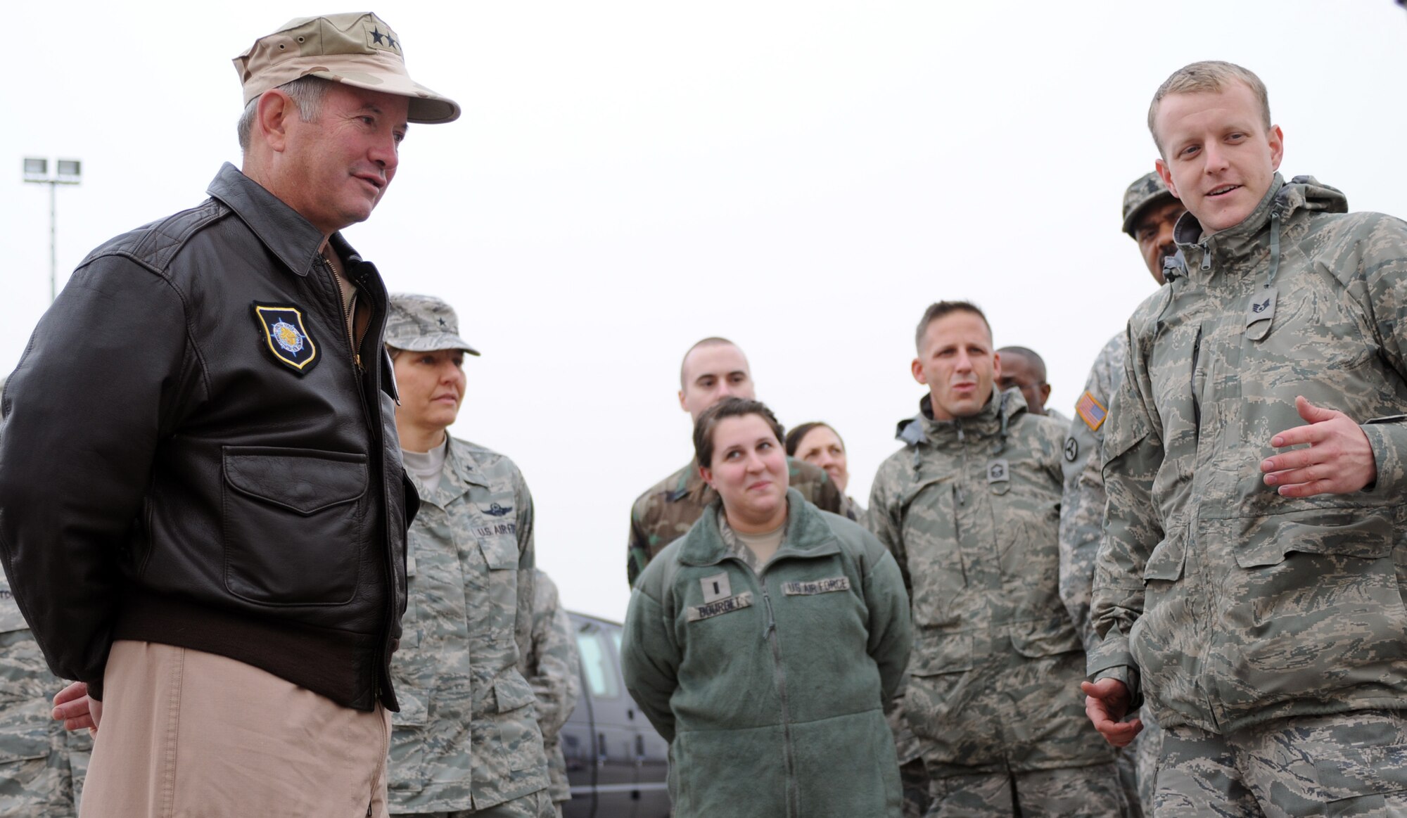 Staff Sgt. Christopher Messer, with the 728th Air Mobility Squadron, explains the 728th AMC mission to Gen. Duncan J. McNabb, the commander of the U.S. Transportation Command, during his visit Dec. 17, 2010 to Incirlik Air Base, Turkey. During General McNabb’s visit to the 39th Air Base Wing he spoke to Airmen from around the wing at a commander’s call and visited with members of the 39th Maintenance Squadron, 728th AMS, 39th Security Forces Squadron and the 90th Expeditionary Air Refueling Squadron. (U.S. Air Force photo by Senior Airman Sara Csurilla/Released)