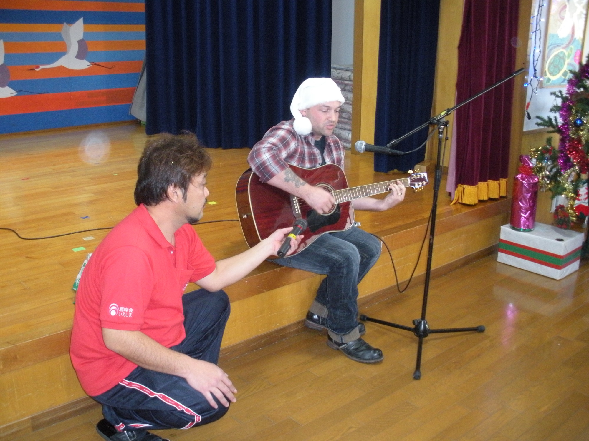 Tech. Sgt. Dave Petty from the 18th Logistics Readiness Squadron prepares to entertain residents at the Iejima Island Elder’s Home during one of the squadron's recent volunteer efforts outside the base. (Courtesy photo / 18th Logistics Readiness Squadron)