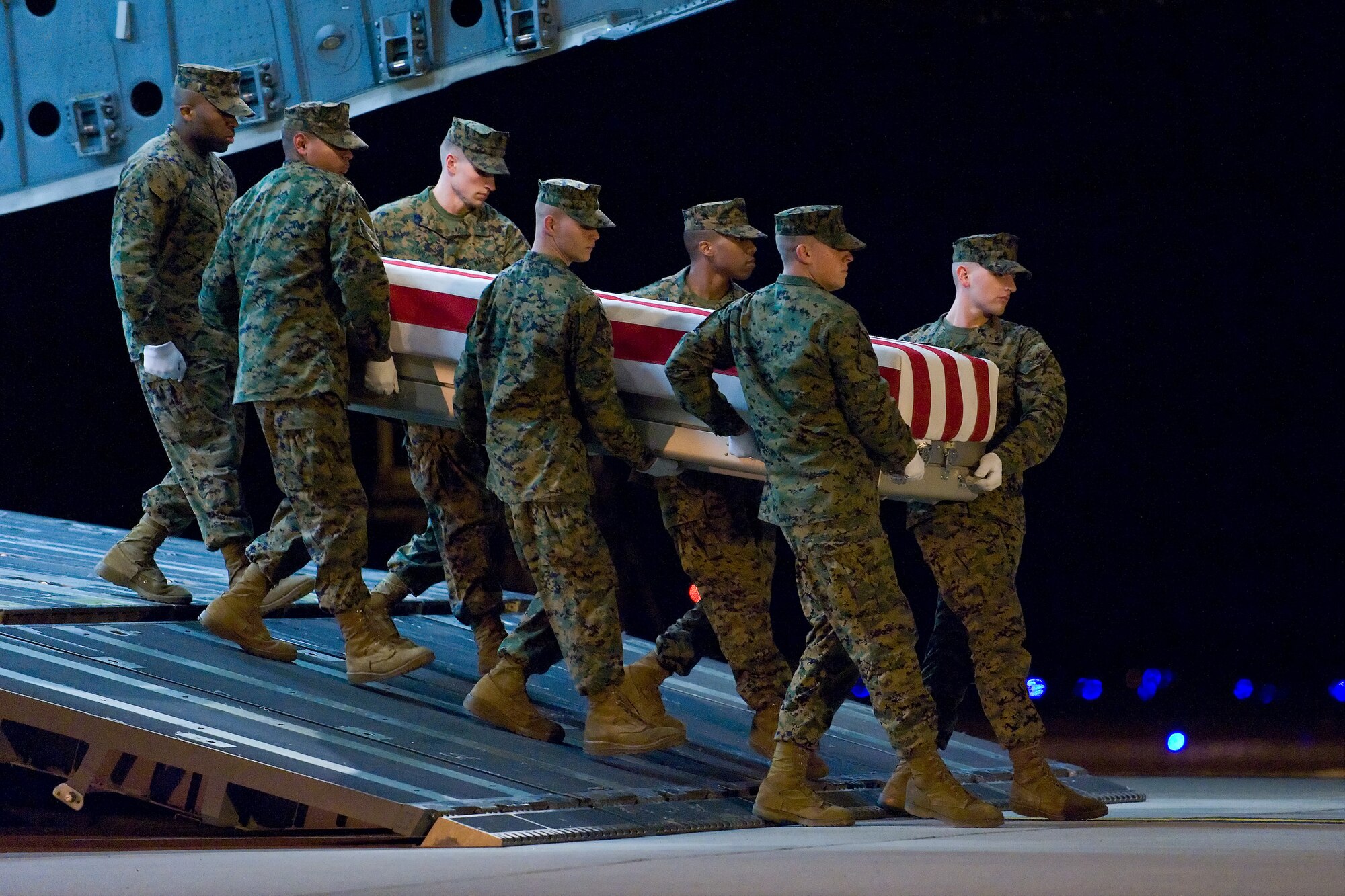A U.S. Marine Corps carry team transfers the remains of Marine Cpl. Sean A. Osterman, of Princeton, Minn., at Dover Air Force Base, Del., Dec. 21, 2010. Osterman was assigned to the 2nd Reconnaissance Battalion, 2nd Marine Division, II Marine Expeditionary Force, Camp Lejeune, N.C.  (U.S. Air Force photo/Roland Balik)
