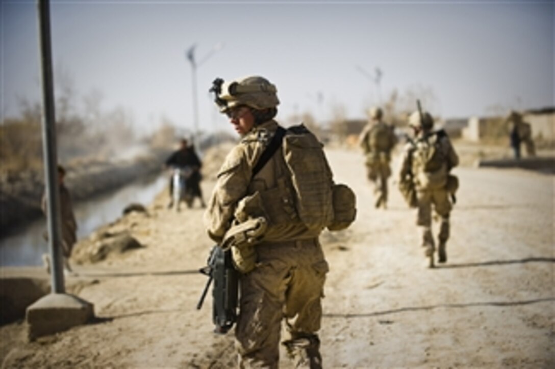 U.S. Marines with 3rd Battalion, 9th Marine Regiment patrol the streets of Marjah in Helmand province, Afghanistan, on Dec. 17, 2010.  
