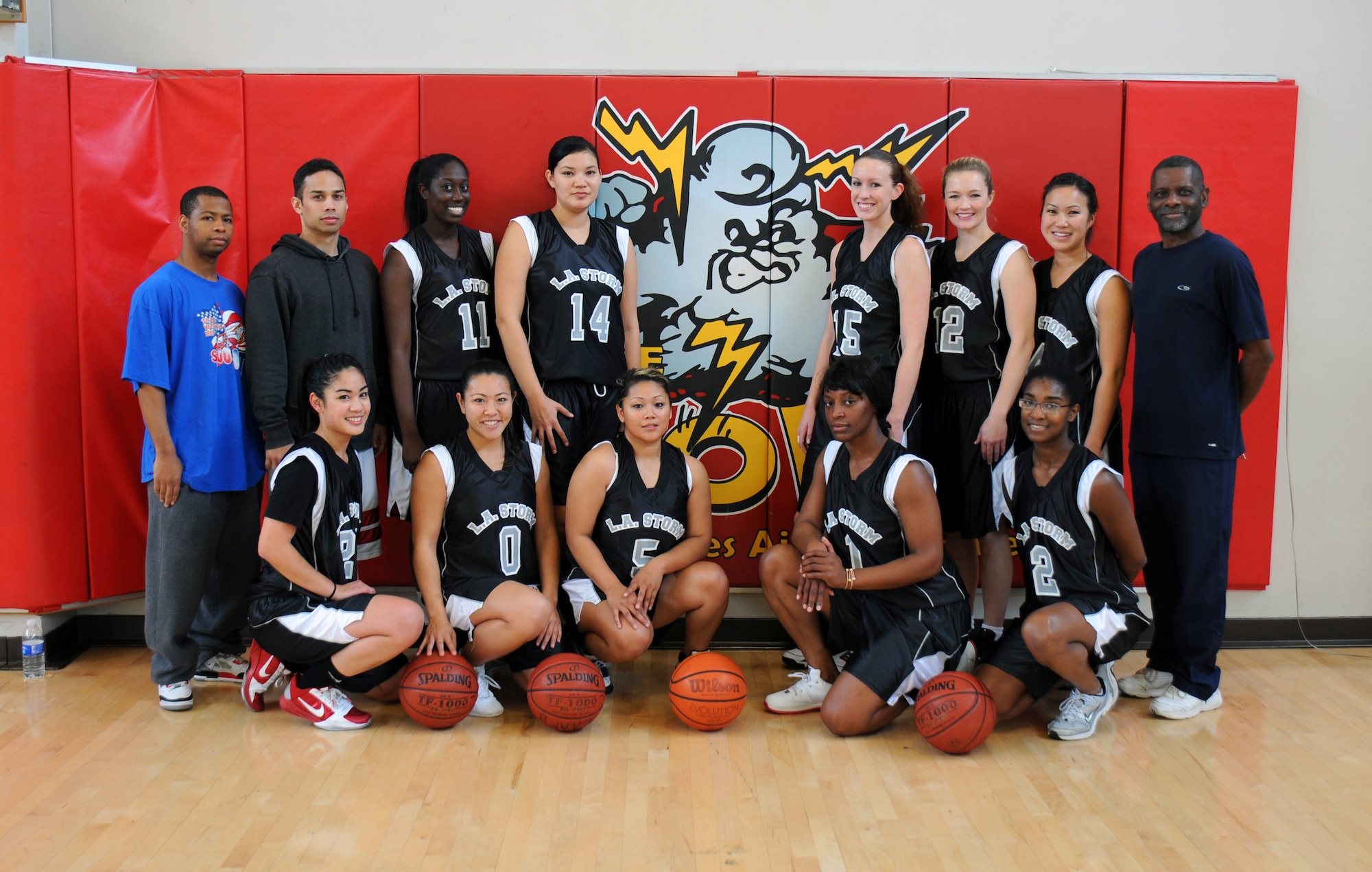 The LAAFB Storm team poses for picture before a game against the Vandenberg’s Lady Hawks Dec. 18, 2010.  The Storm reigned the court in a 53-22 win.  (Photo by Joe Juarez)
