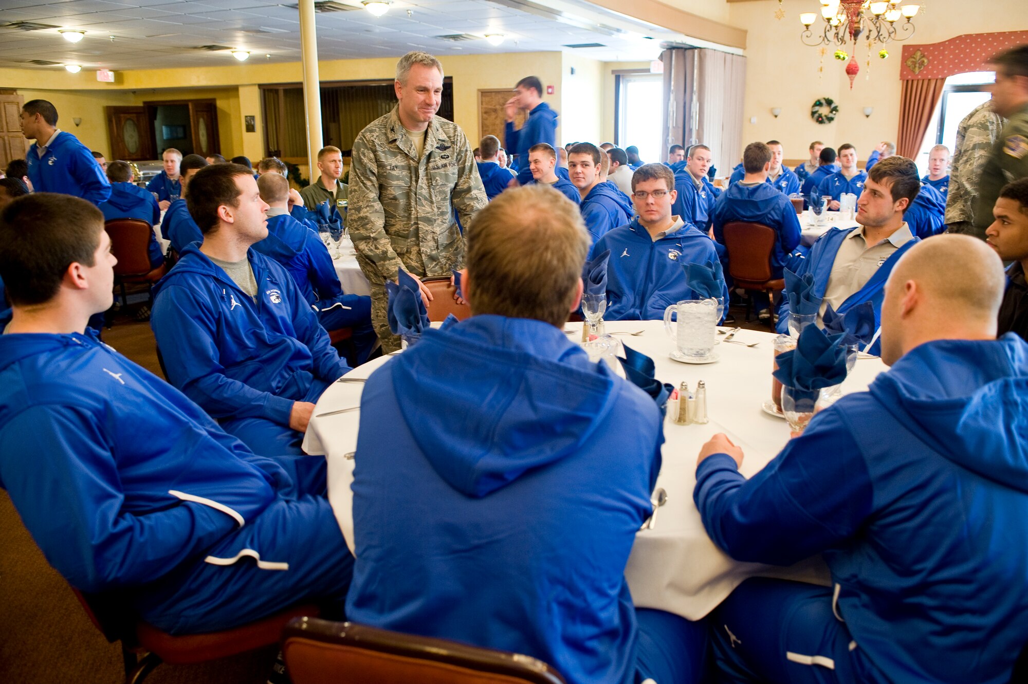 Col. Tim Fay, 2nd Bomb Wing commander, talks to members of the U.S. Air Force Academy football team during a lunch on Barksdale Air Force Base, La., Dec. 23. Colonel Fay is a 1987 distinguished graduate of the U.S. Air Force Academy. The team is in town for the AdvoCare V100 Independence Bowl Monday where the Falcons will face the Georgia Tech Yellow Jackets. (U.S. Air Force photo/Senior Airman Chad Warren)