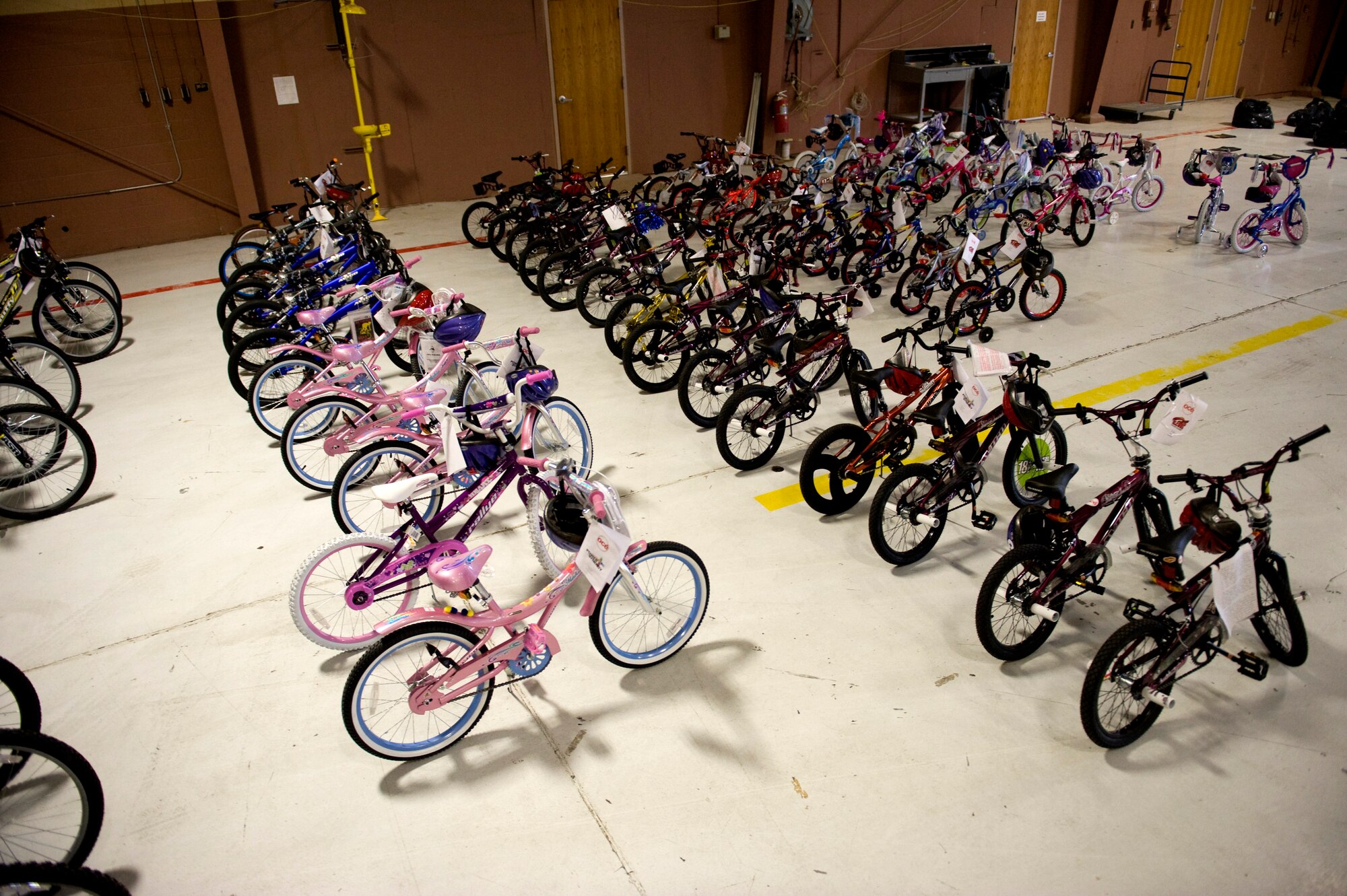 NELLIS AIR FORCE BASE, Nev. -- Bicycles sit, ready to be picked up by families at Nellis AFB, Dec. 20. Océ, a technology and services company, donated more than 80 different bicycles to Nellis Airmen and families.(U.S. Air Force photo by Senior Airman Brett Clashman/Released)
