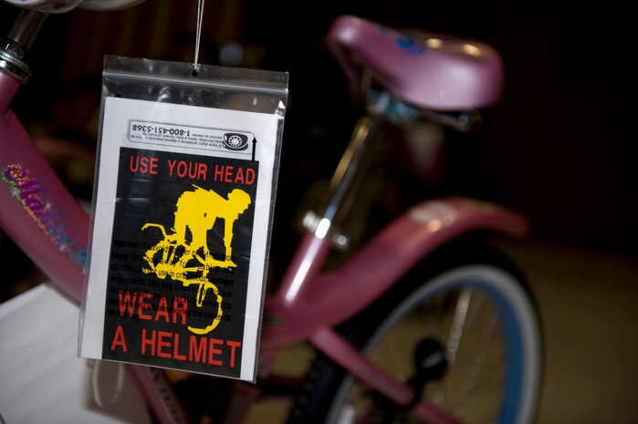 NELLIS AIR FORCE BASE, Nev. -- Safety is mandatory when riding bicycles on Nellis AFB. Océ, a technology and services company, donated more than 80 different bicycles to Nellis Airmen and families.(U.S. Air Force photo by Senior Airman Brett Clashman/Released)
