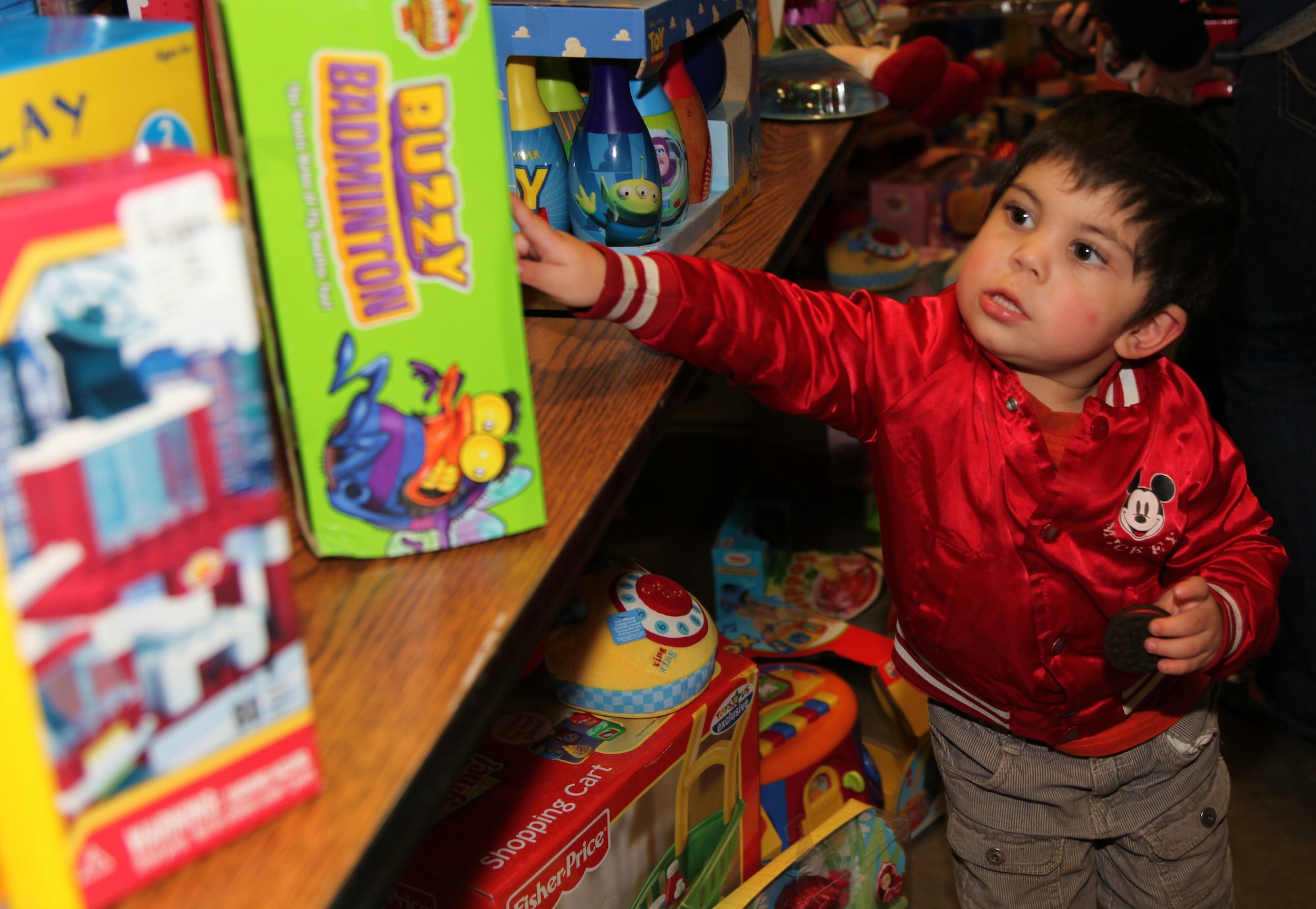 An excited youngster points to the toy he wants during the Military Children’s Christmas Party at the Roseville, Calif. National Guard Armory, Dec. 18. The party was organized by Never Forget Our Fallen, an organization started by Deborah Getz in honor of her son who lost his life in 2007 while serving with the Army in Afghanistan. (U.S. Air Force photo/Tech. Sgt. Kenneth McCann) 