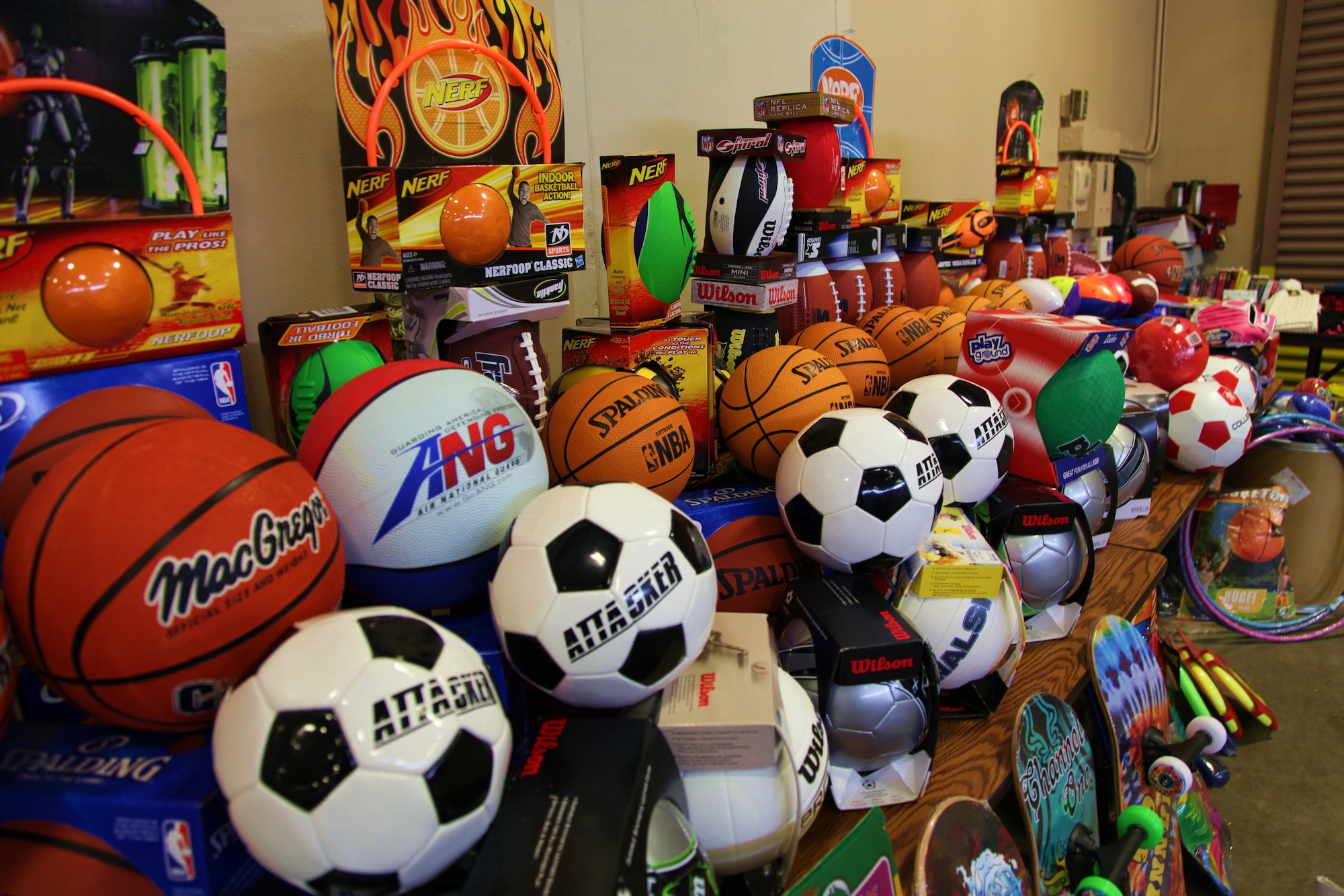 Sporting equipment and other toys line the walls of the Roseville, Calif. National Guard Armory waiting to be chosen by children of military families at the Military Children’s Christmas Party, Dec. 18. The party was organized by Never Forget Our Fallen, an organization started by Deborah Getz in honor of her son who lost his life in 2007 while serving with the Army in Afghanistan. (U.S. Air Force photo/Tech. Sgt. Kenneth McCann) 