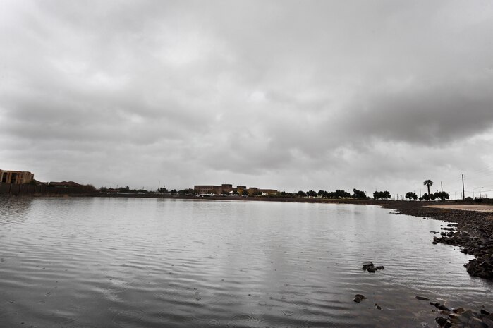 NELLIS AIR FORCE BASE, Nev.--  Water accumulates in a sump in front of the Mike O'Callaghan Federal Hospital Dec. 22.  A heavy winter rainstorm slammed southern Nevada the fourth week of December. More than an inch of rain was recorded at Nellis over the week. The base populace is reminded when a flash-flood warning is issued that flooding is imminent or occurring. Those living in the affected areas should move to safety  immediately. (U.S. Air Force photo by Lawrence Crespo/Released)