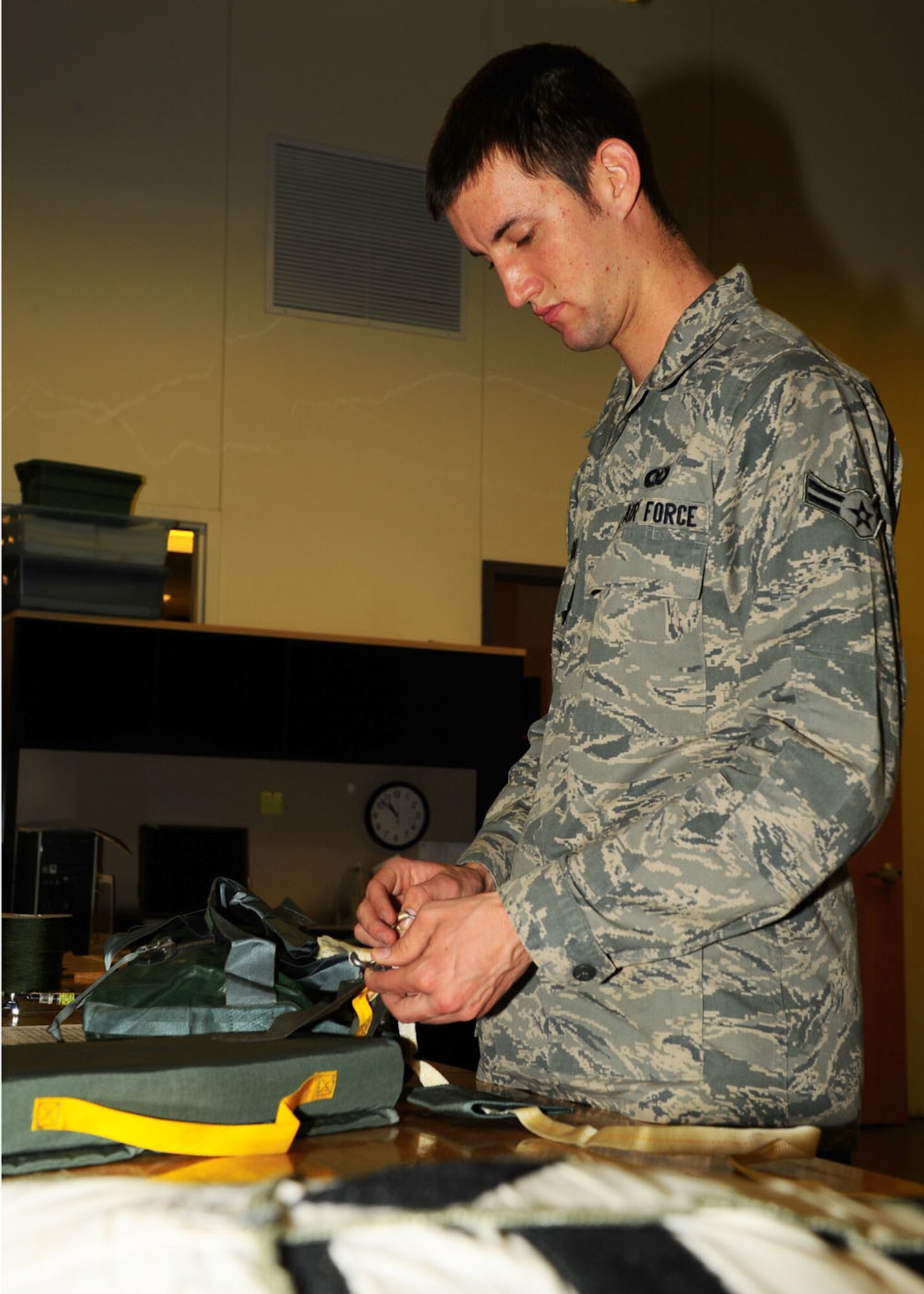 Dyess Air Force Base, Texas - Airman 1st Class Sean Meares, 7th Operations Support Squadron aircrew flight equipment technician, assembles a survival kit to be put on the B-1 Bomber. The operations support squadron is responsible for B-1 Bomber combat effectiveness. The squadron directs wing flight operations, conventional mission planning, combat tactics, airfield management, aircrew training, exercise scheduling, aircraft scheduling, weapons and tactics standardization, intelligence integration, war plans, deployment planning, weather support, small computer support, simulator training, air traffic control and wing life support functions. (U.S. Air Force photo/Airman 1st Class Courtney Moses)