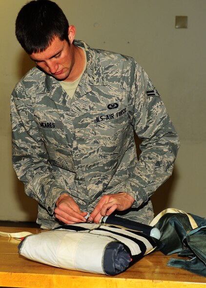 Dyess Air Force Base, Texas - Airman 1st Class Sean Meares, 7th Operations Support Squadron aircrew flight equipment technician, assembles a survival kit to be put on the B-1 Bomber. The operations support squadron is responsible for B-1 Bomber combat effectiveness. The squadron directs wing flight operations, conventional mission planning, combat tactics, airfield management, aircrew training, exercise scheduling, aircraft scheduling, weapons and tactics standardization, intelligence integration, war plans, deployment planning, weather support, small computer support, simulator training, air traffic control and wing life support functions. (U.S. Air Force photo/Airman 1st Class Courtney Moses)